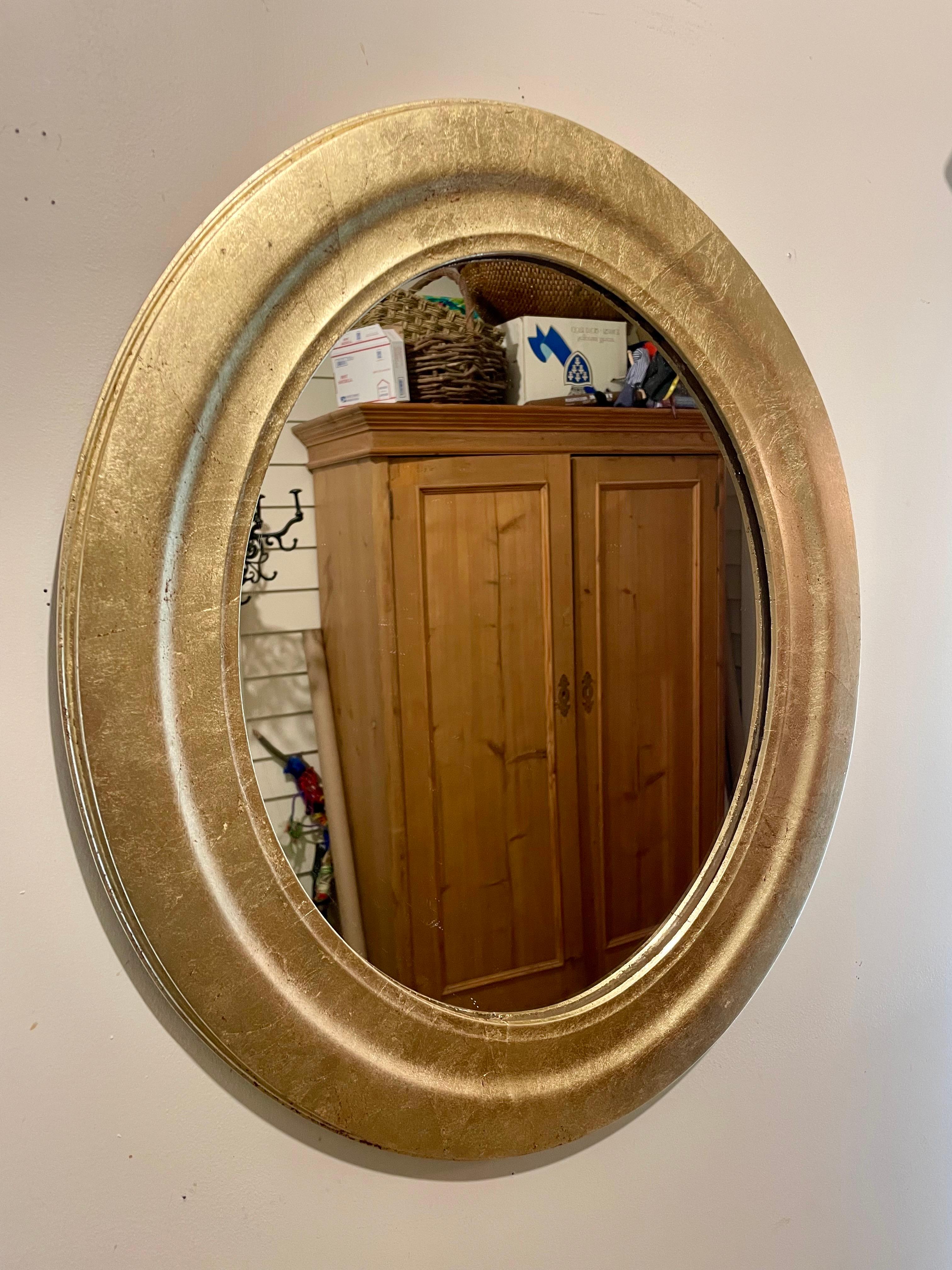 Italian gilt wood oval mirror. Great size, Measures 22