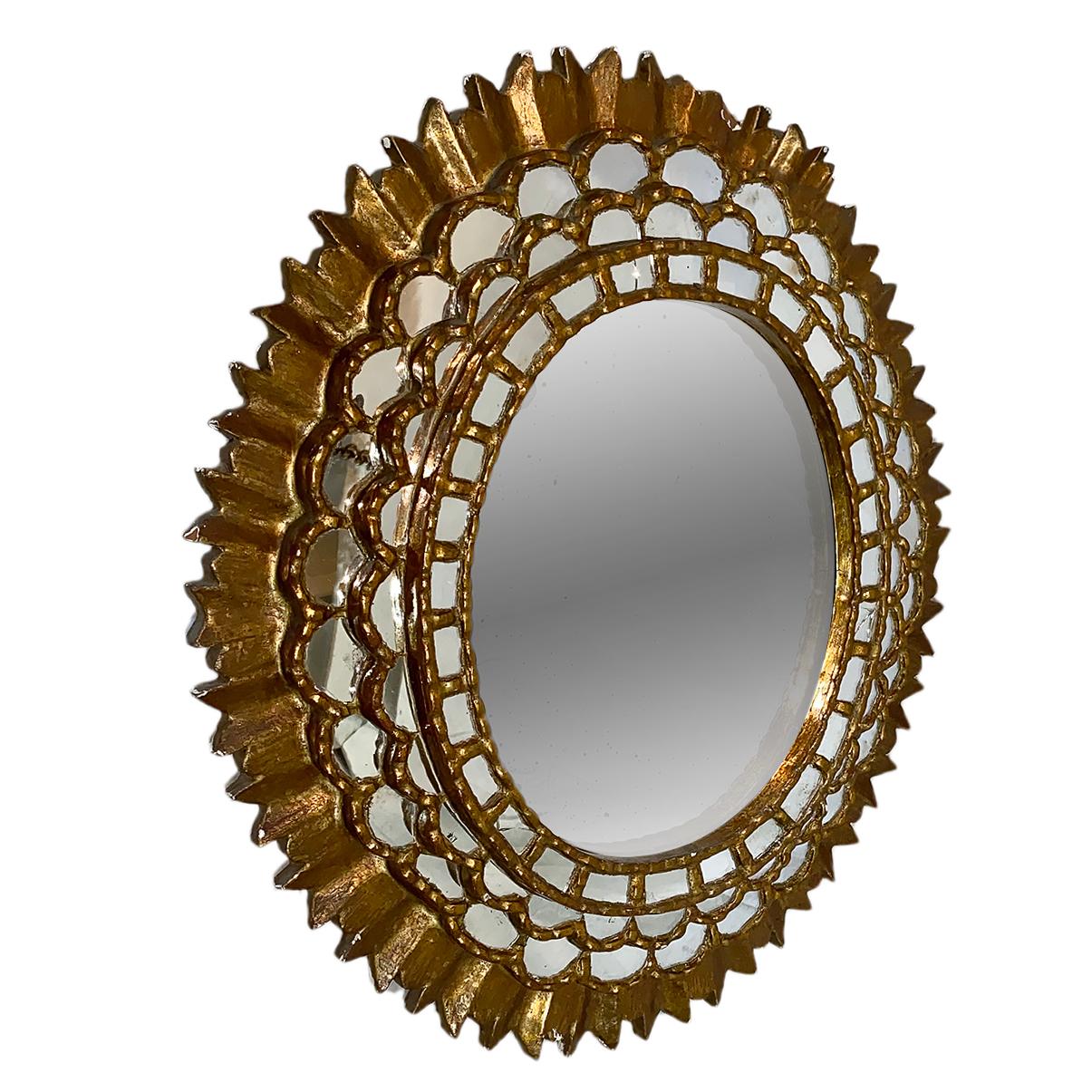 A circa 1920s Spanish giltwood sunburst mirror.

Measurements:
Height 40