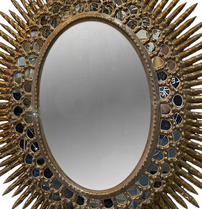 A circa 1920s Spanish gilt wood sunburst mirror.

Measurements:
Height: 40