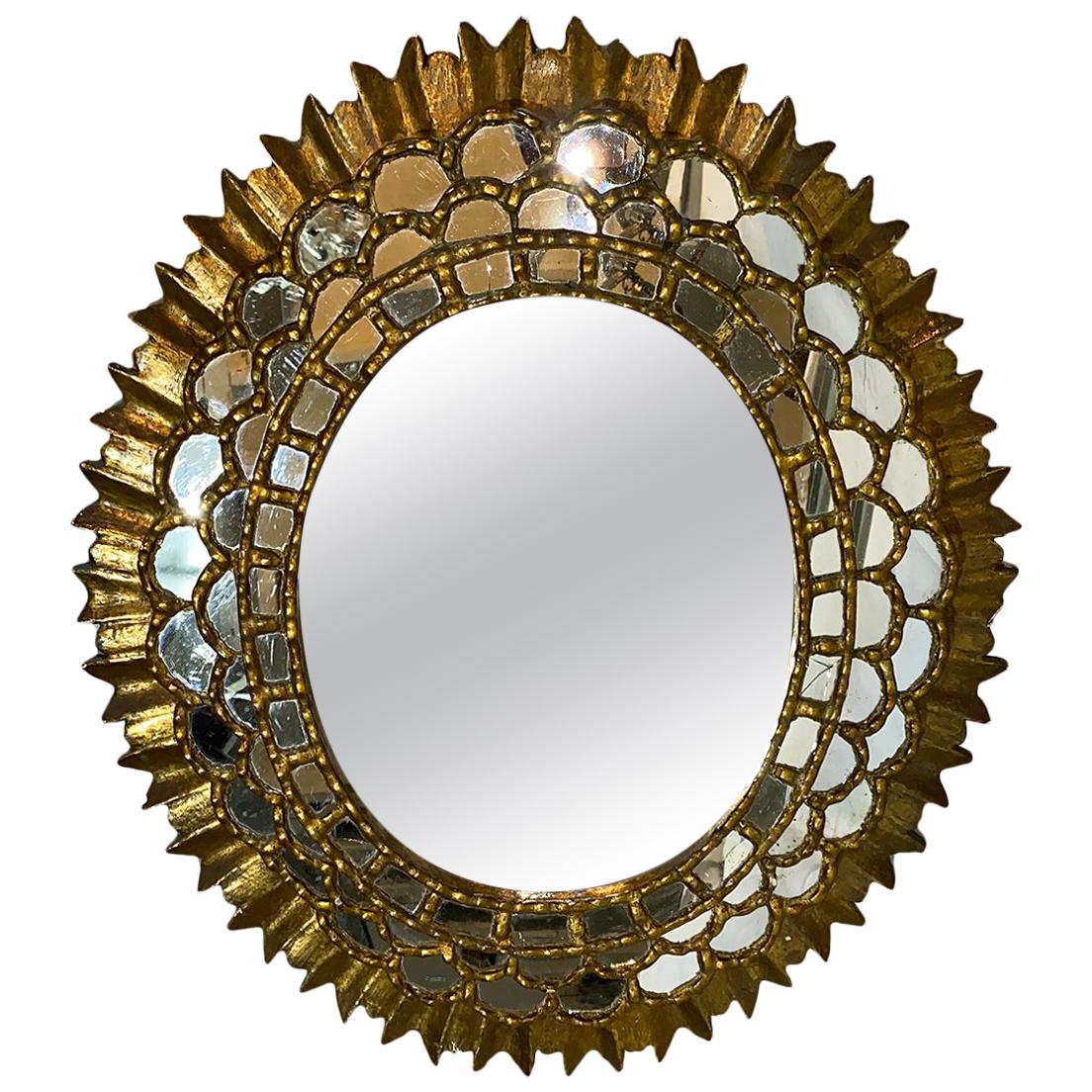 Miroir ovale en bois doré Sunburst