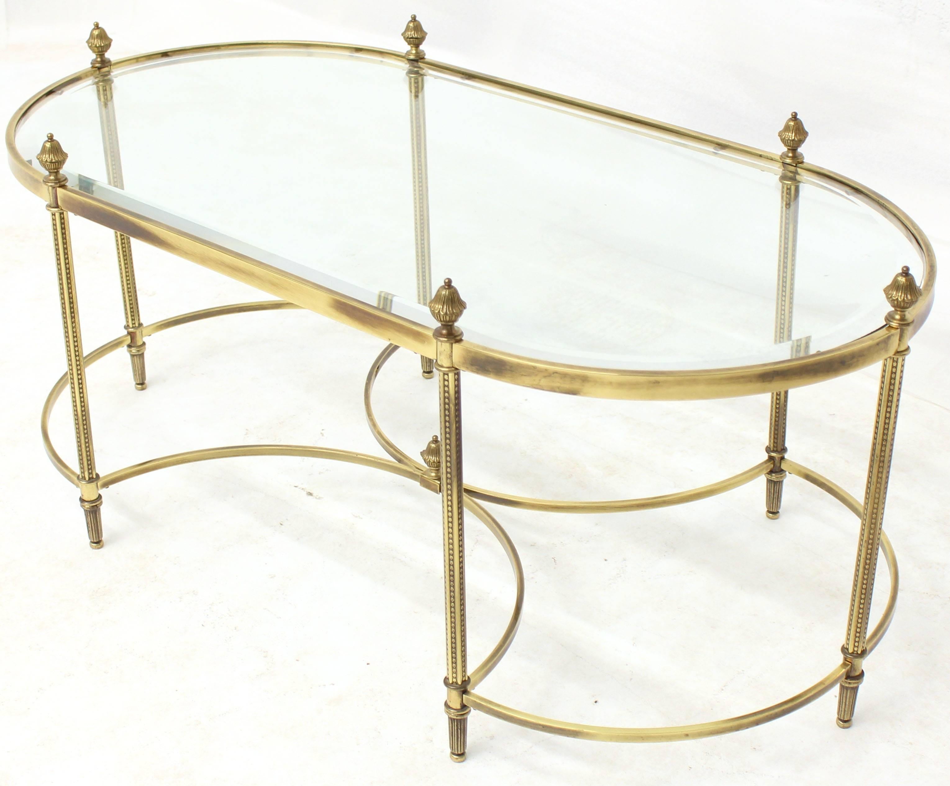 Decorative elegant design brass and glass coffee table from circa 1970s.