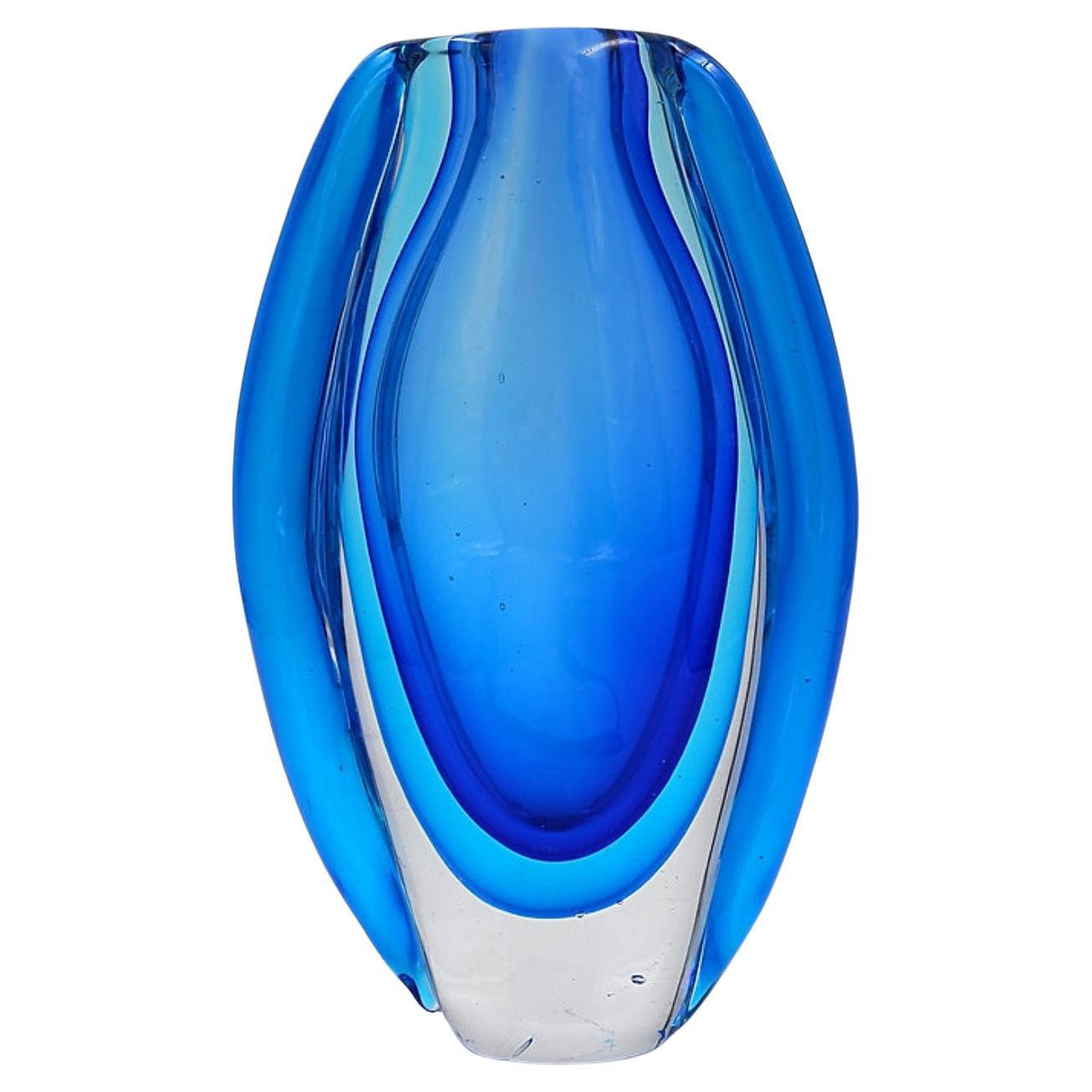 Oval glass vase in shades of blue, in the style of Sommerso