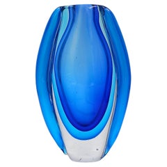 Oval glass vase in shades of blue, in the style of Sommerso