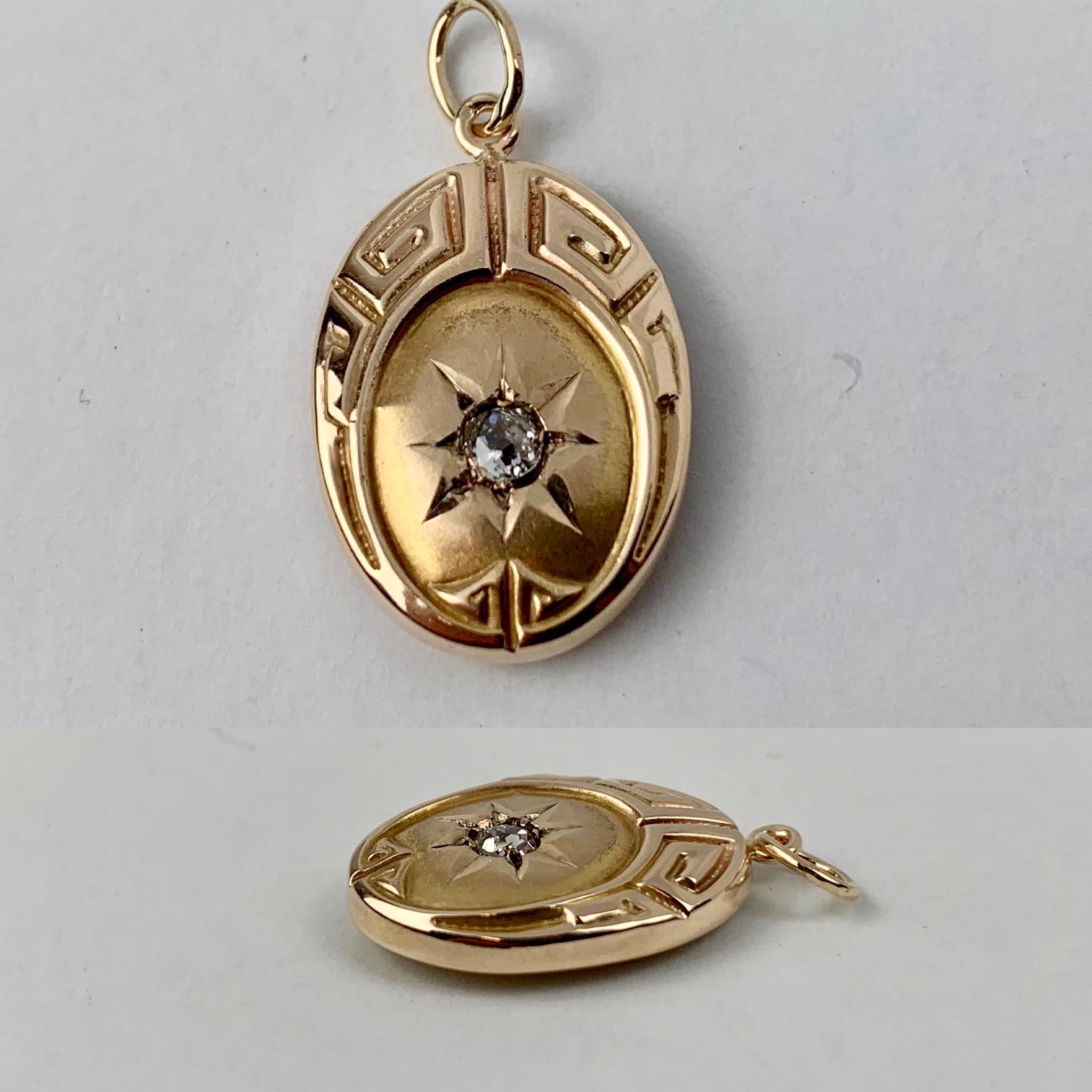 Perfect little oval 10k yellow gold pendant with a Greek key motif and a diamond centered in a sunburst.
Professionally cleaned and polished.
1.2 grams