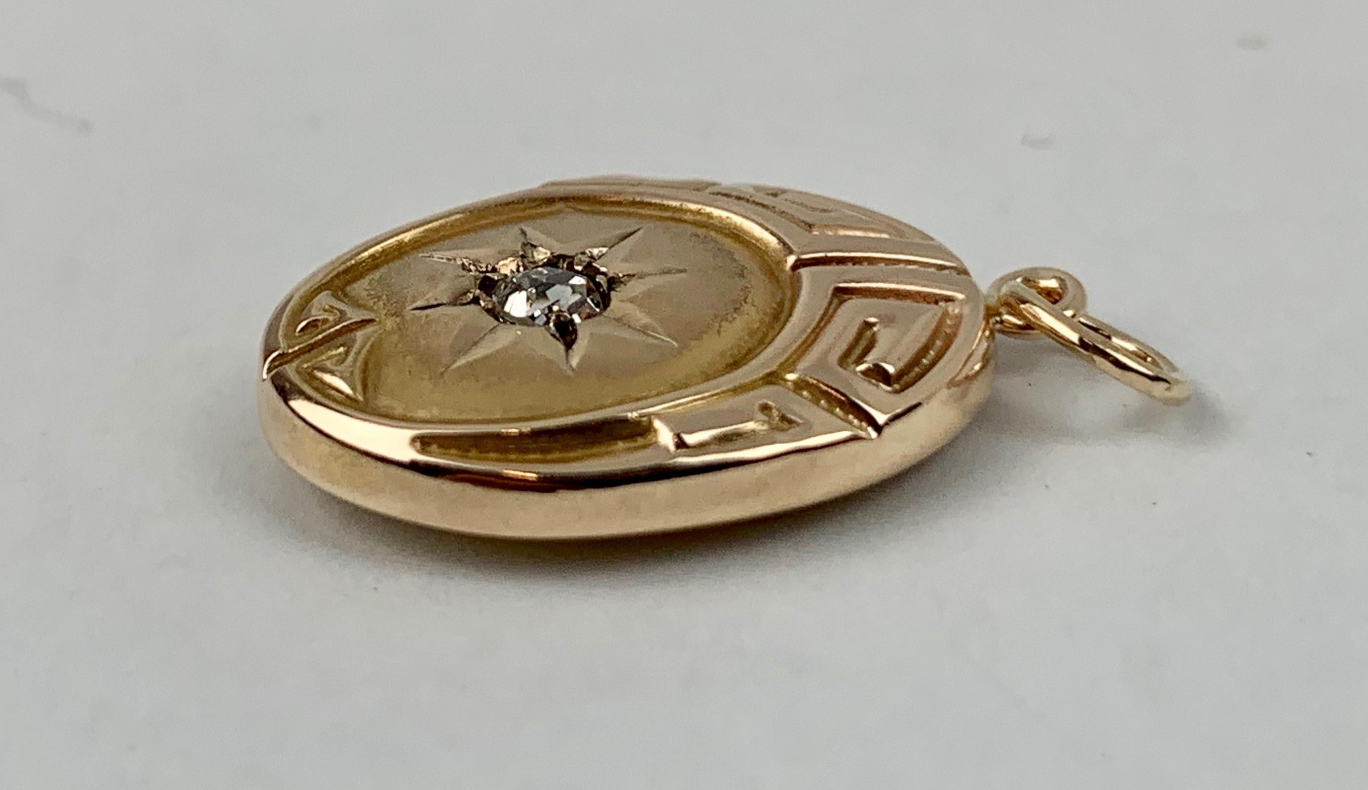 Late Victorian  Pendant of Oval Shape with Greek Key Motif & Diamond set in 10K Yellow Gold 