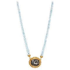 Oval granulation Pendant Necklace with a Lion eats a Deer 22kt Gold aquamarine