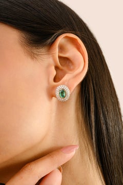 Oval Green Emerald and Double Diamond Halo Stud Earrings in 14K Yellow Gold
