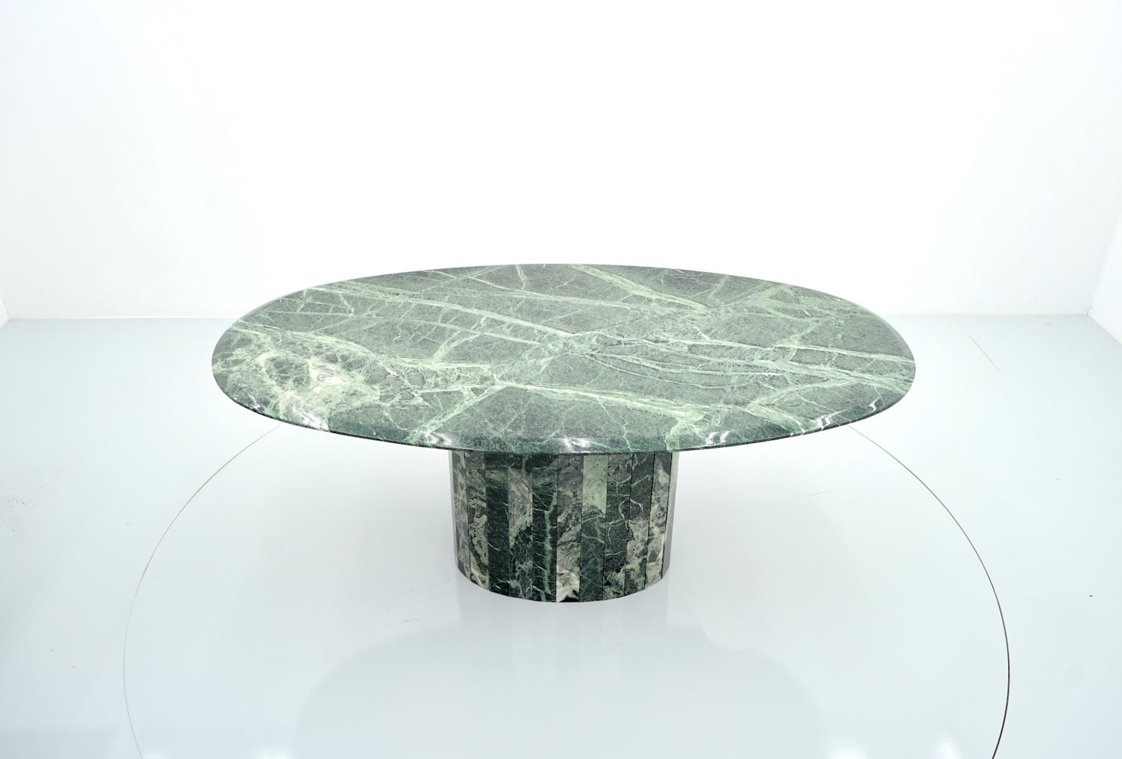 Amazing large oval dining table in green marble. The table has no damage and no repairs. 
The table dates back to the 1970s and comes from Italy. 
Very good condition without any damages, cracks or repairs. 

Details:

Creator: