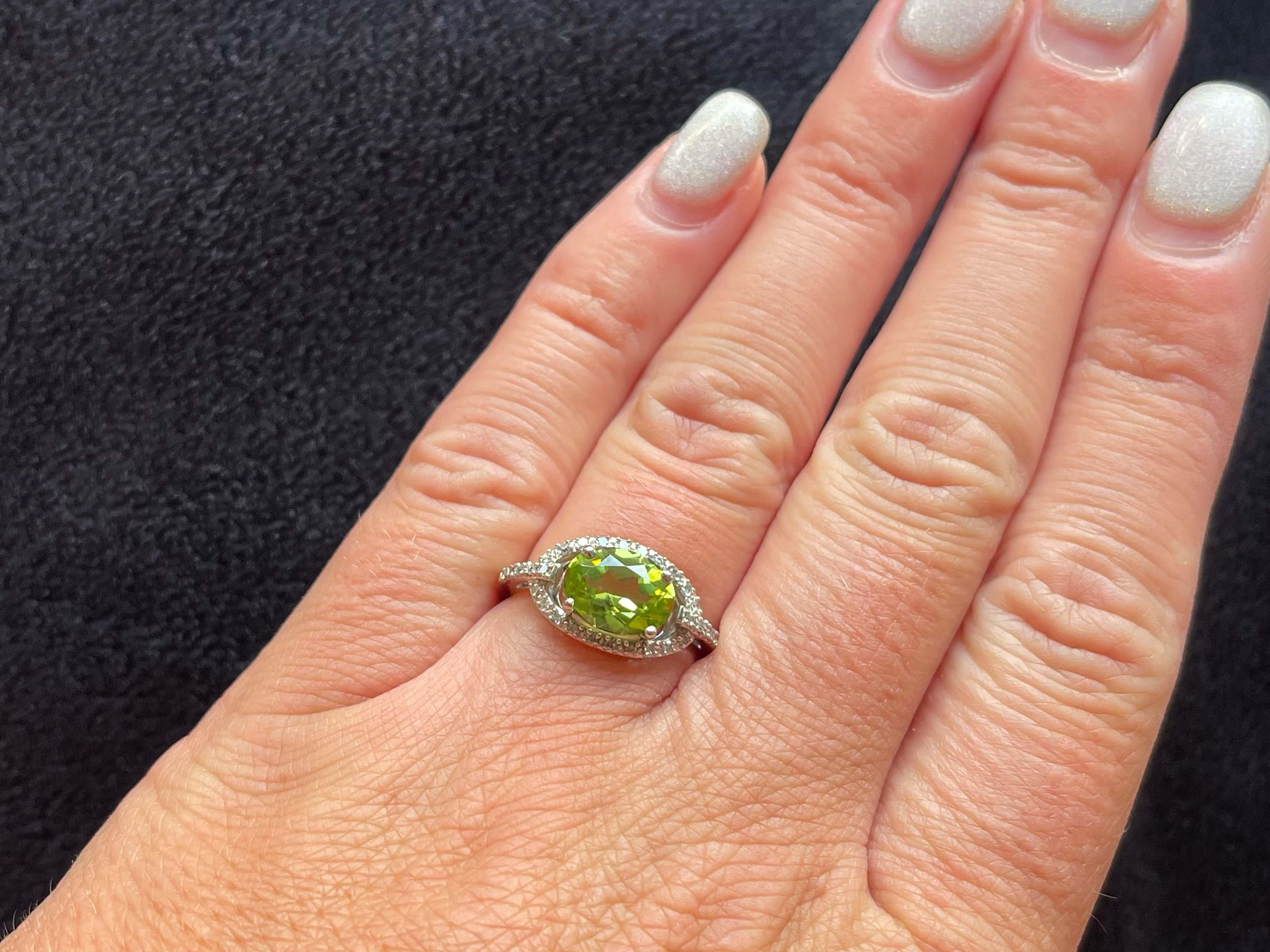 Item Specifications:

Metal: 14K White Gold

Style: Statement Ring

Ring Size: 5.5 (resizing available for a fee)

Total Weight: 2.9 Grams

Gemstone Specifications:

Gemstones: 1 green peridot

Peridot Measurements: 9.14 x 7.06 x 4.30
​
​Diamond