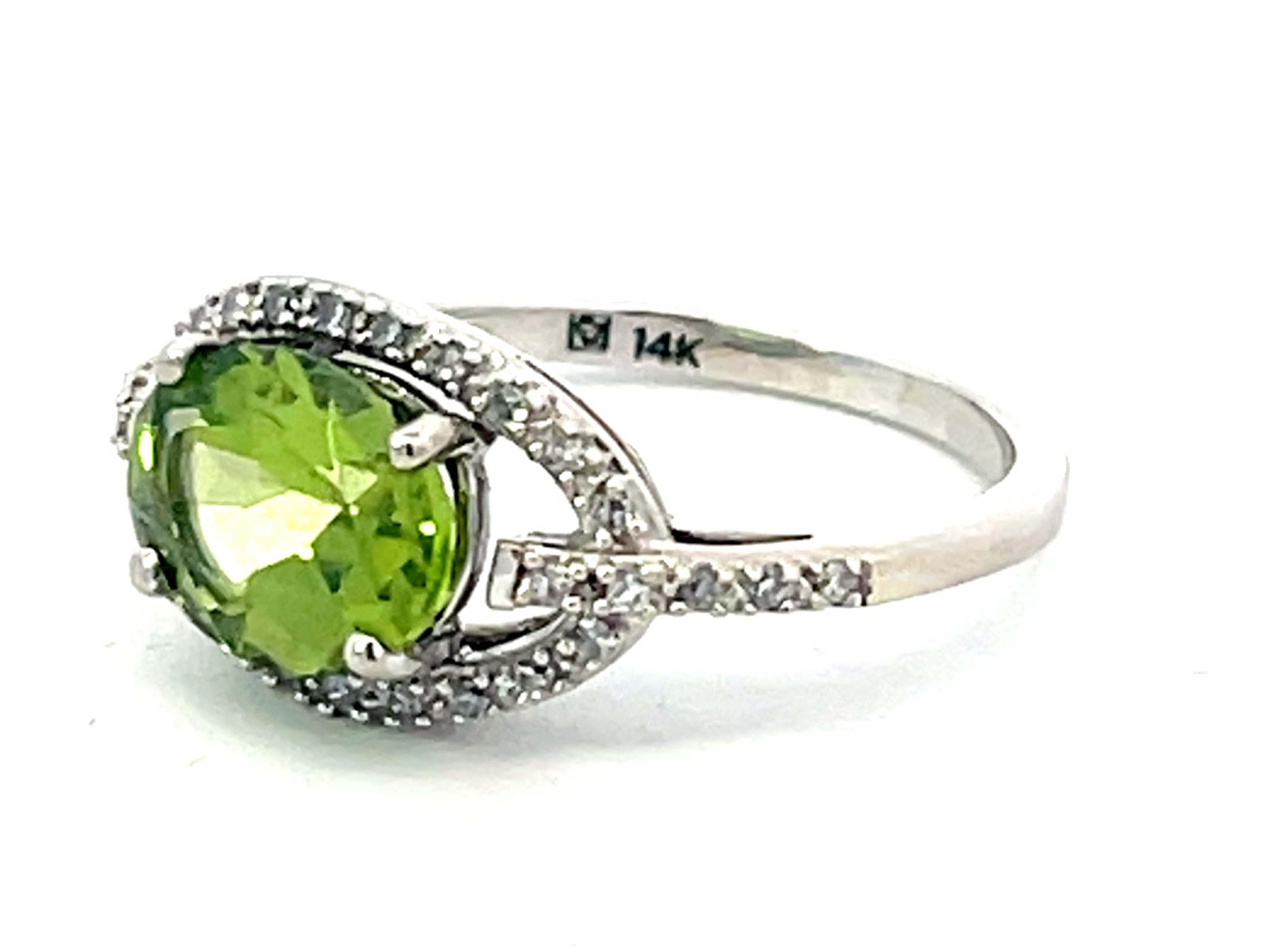 Modern Oval Green Peridot and Diamond Halo Ring in 14k White Gold For Sale
