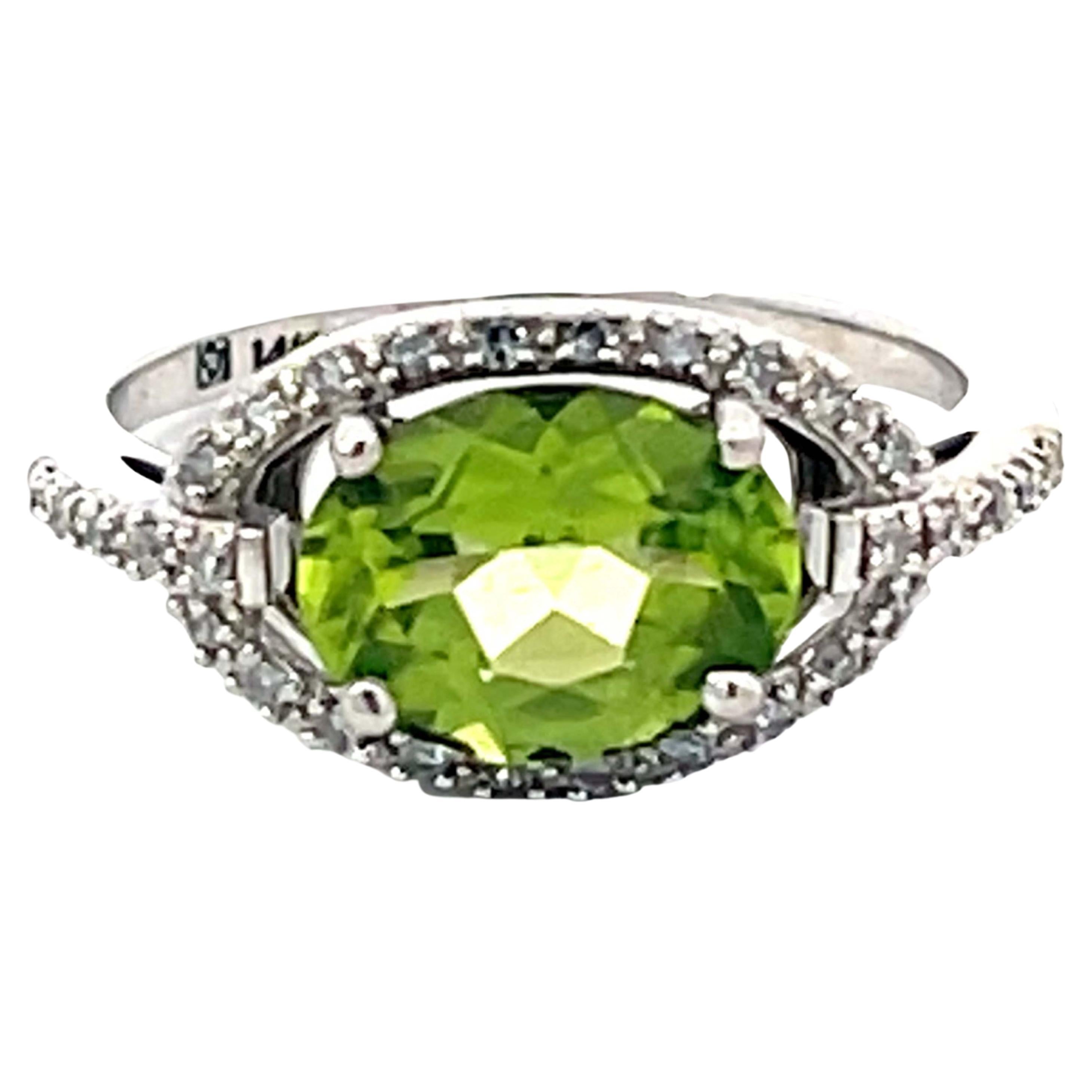 Oval Green Peridot and Diamond Halo Ring in 14k White Gold For Sale