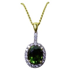 Pendentif en or 18 carats avec tourmaline verte ovale et diamants