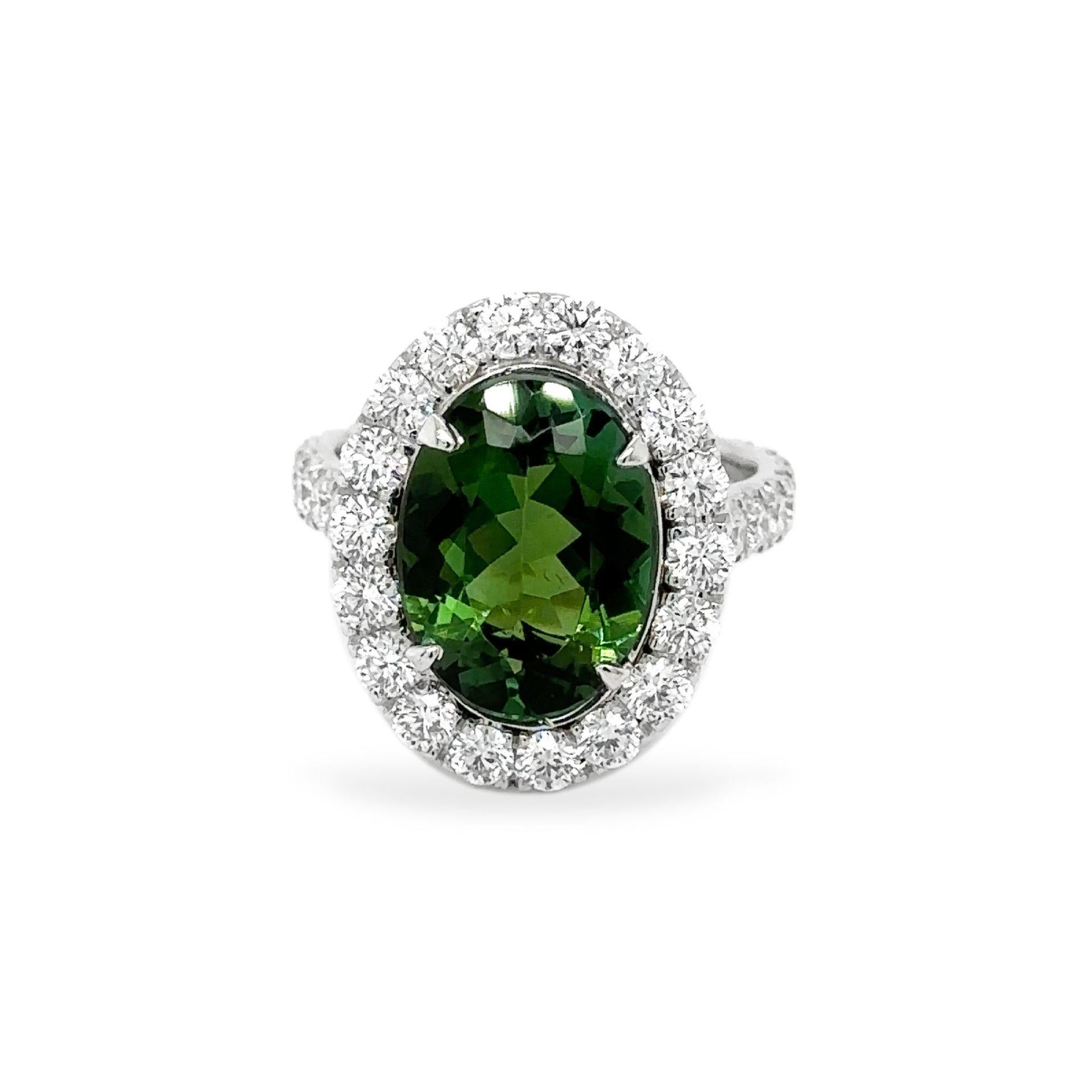 Oval Green Tourmaline Diamond Ring 4.72 carats 

Green Color

Spectacular. Set in Platinum

Stunning!

Oval Tourmaline weighs 4.72 carats. 

Small Round Diamond 2.36 carats DEF Color VVS/VS Clarity

TOTAL CARAT WEIGHT of 7.08 CARATS

Set in