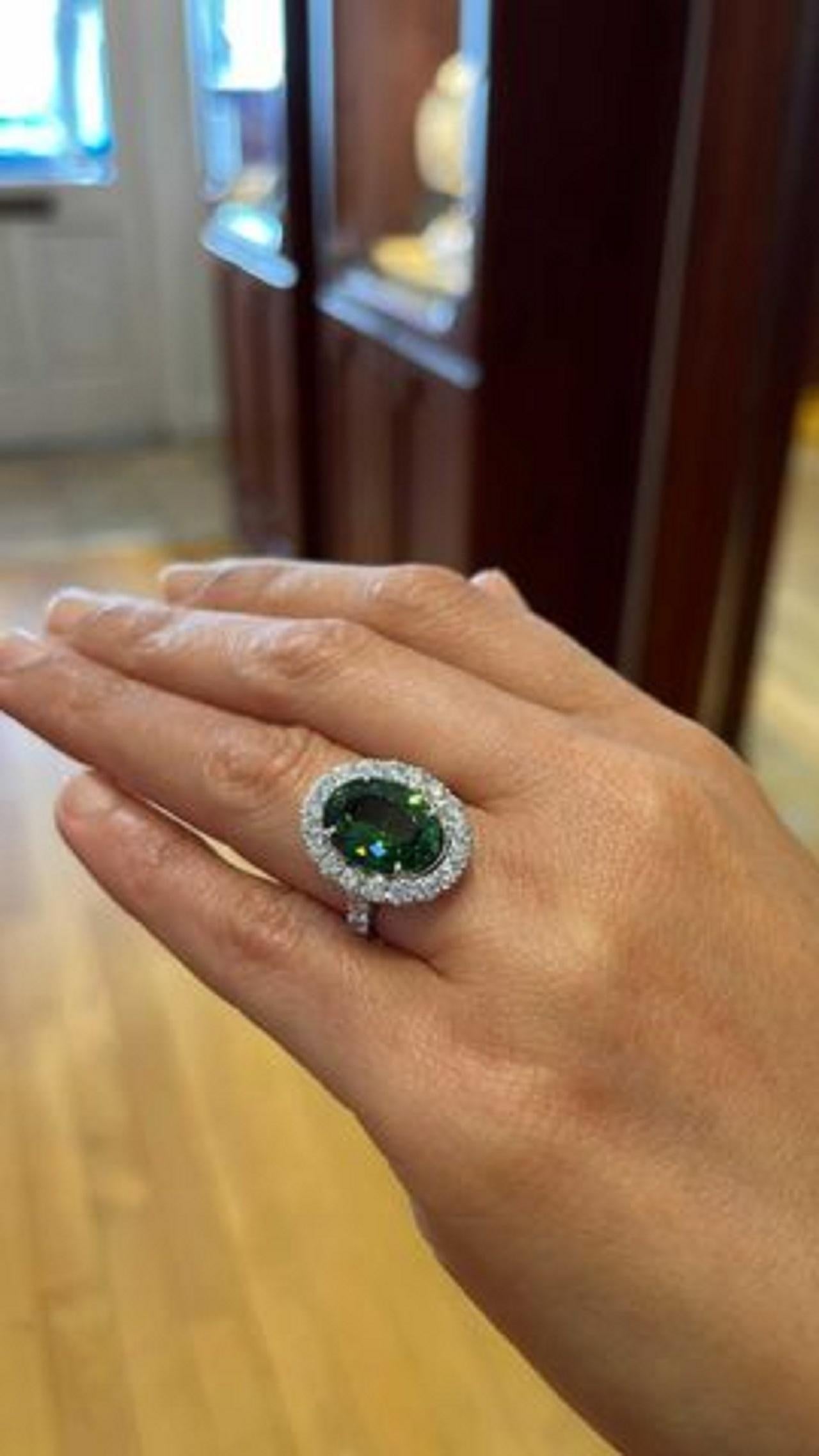 Contemporary Oval Green Tourmaline and Diamond Ring 7.08 carats Platinum For Sale
