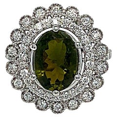Bague en or blanc 14 carats, tourmaline verte ovale et diamant rond