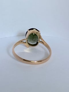 Bague en or jaune 14 carats avec tourmaline verte ovale