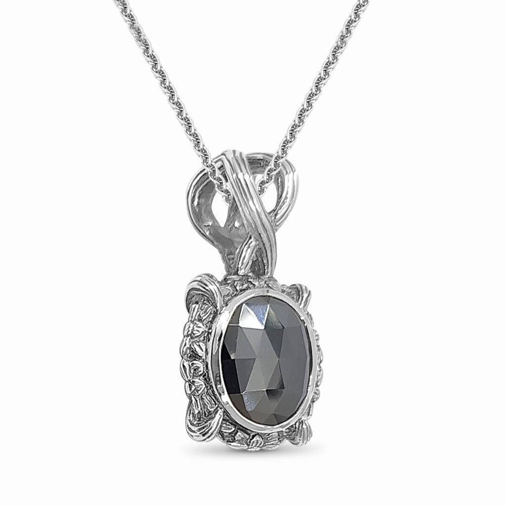 Indulge in the raw beauty of nature with the Oval Hematite Gemstone Pendant, crafted in sterling silver to showcase the captivating allure of hematite. Each pendant in this collection celebrates the unique striations and natural nuances of rare