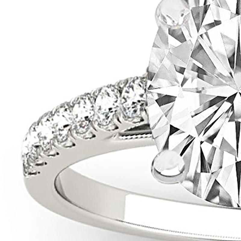 This ring features a hidden halo design of G color, VS1 clarity and .40ct side diamonds set in 14K white gold. The center diamond is a 2.00ct Oval J Color, SI2 Clarity GIA certified diamond. Available in 14k, 18k white gold, yellow gold, rose gold,