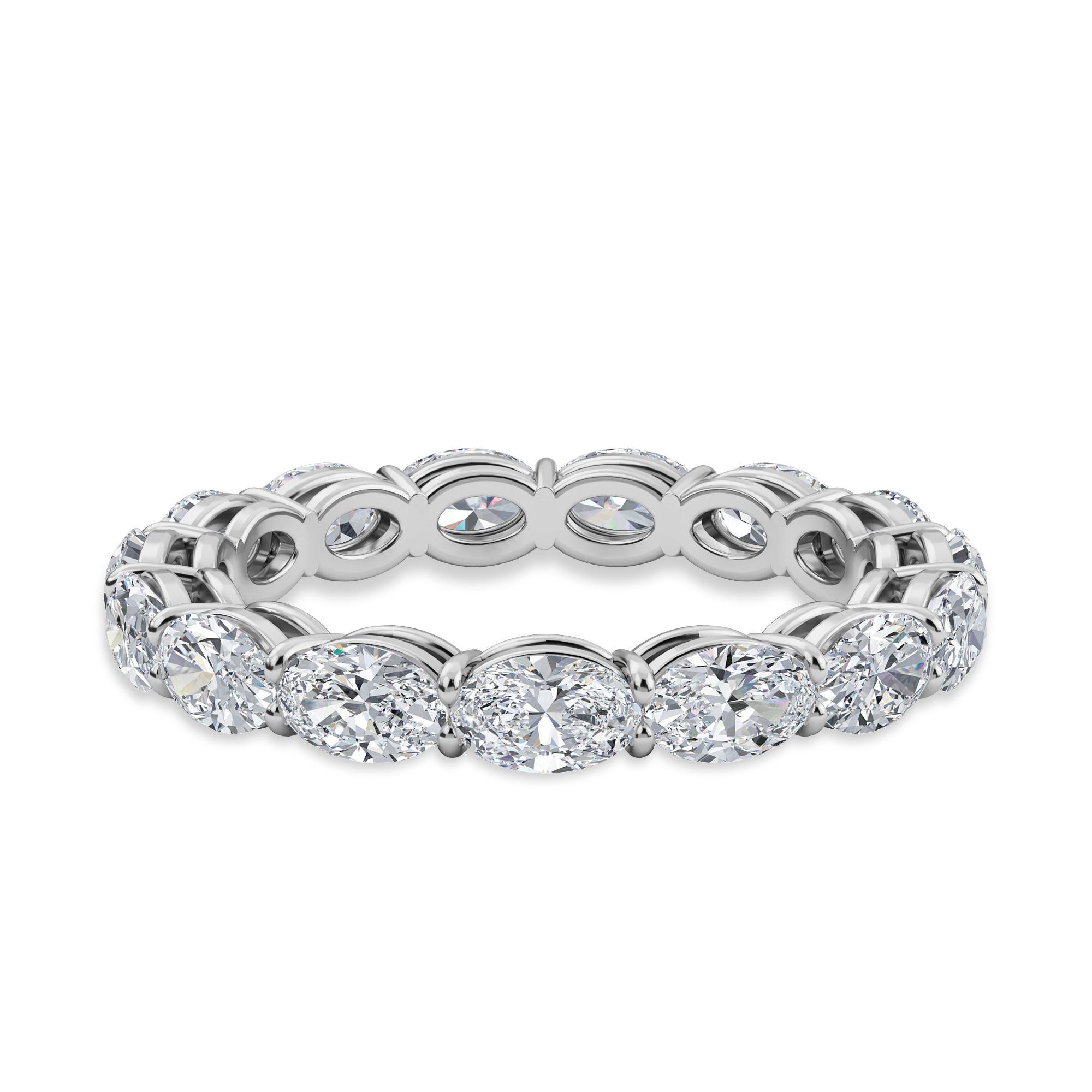 This Oval Horizontal Eternity Band features 15 Oval Diamonds, with a Total Carat Weight of 2.90. The stones are F Color, VS-SI Clarity, and set in a Platinum Comfort Fit Setting. 