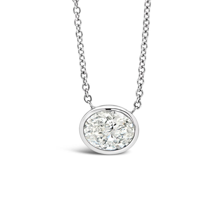 This pendant features a 1.00 carat Oval diamond set horizontally.
The diamond is F Color, SI1 Clarity. The Pendant is set in 18K White Gold.
The Diamond is GIA certified