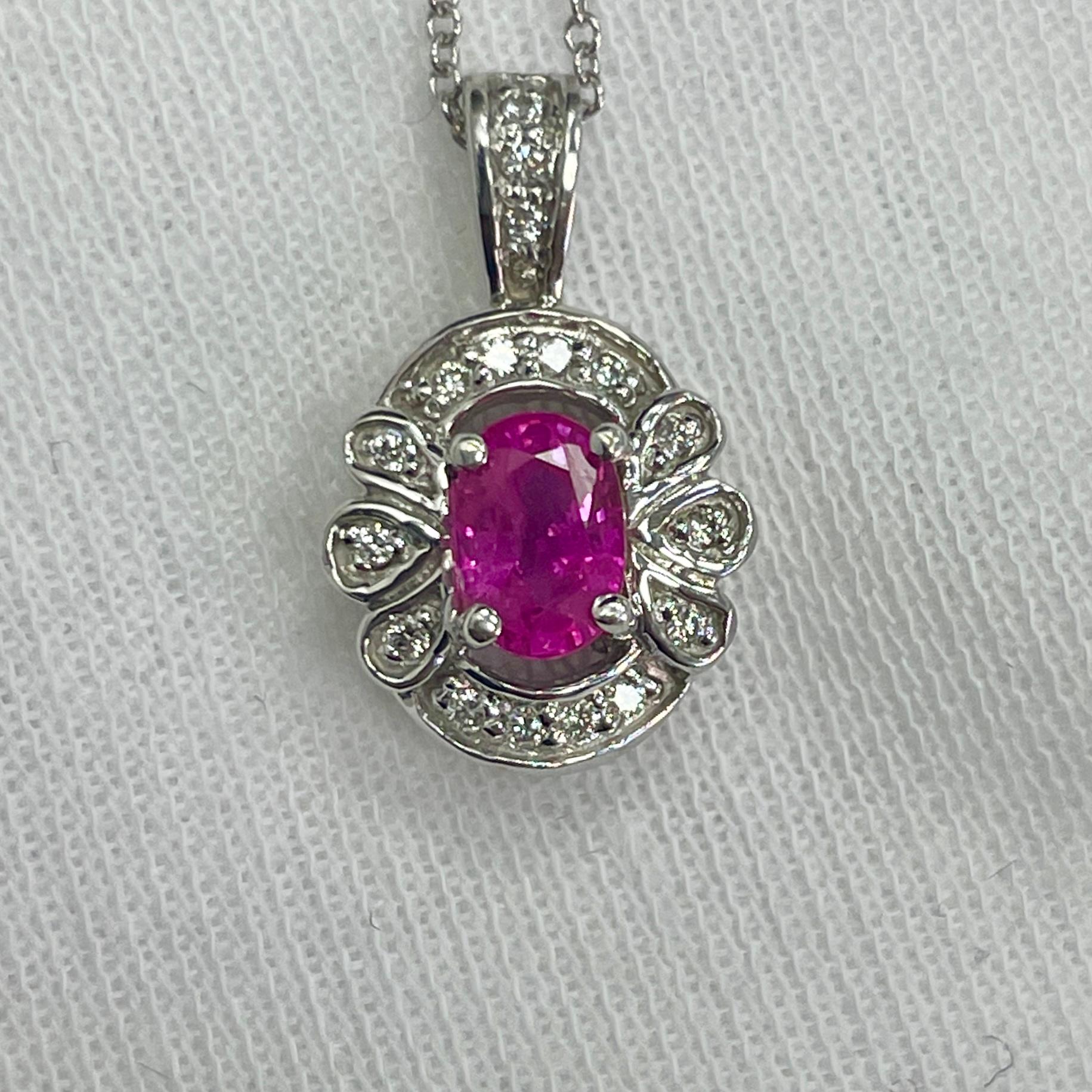 A rich colored, 0.80Ct hot pink sapphire in a diamond (0.09Ct) pendant