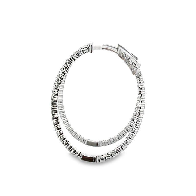 These elegant hoop earrings boast a timeless inside-out oval hoop design that radiates from all angles. They are made from exquisite polished 14K white gold and have a combined weight of 2.18CT of white round diamonds. We provide customization