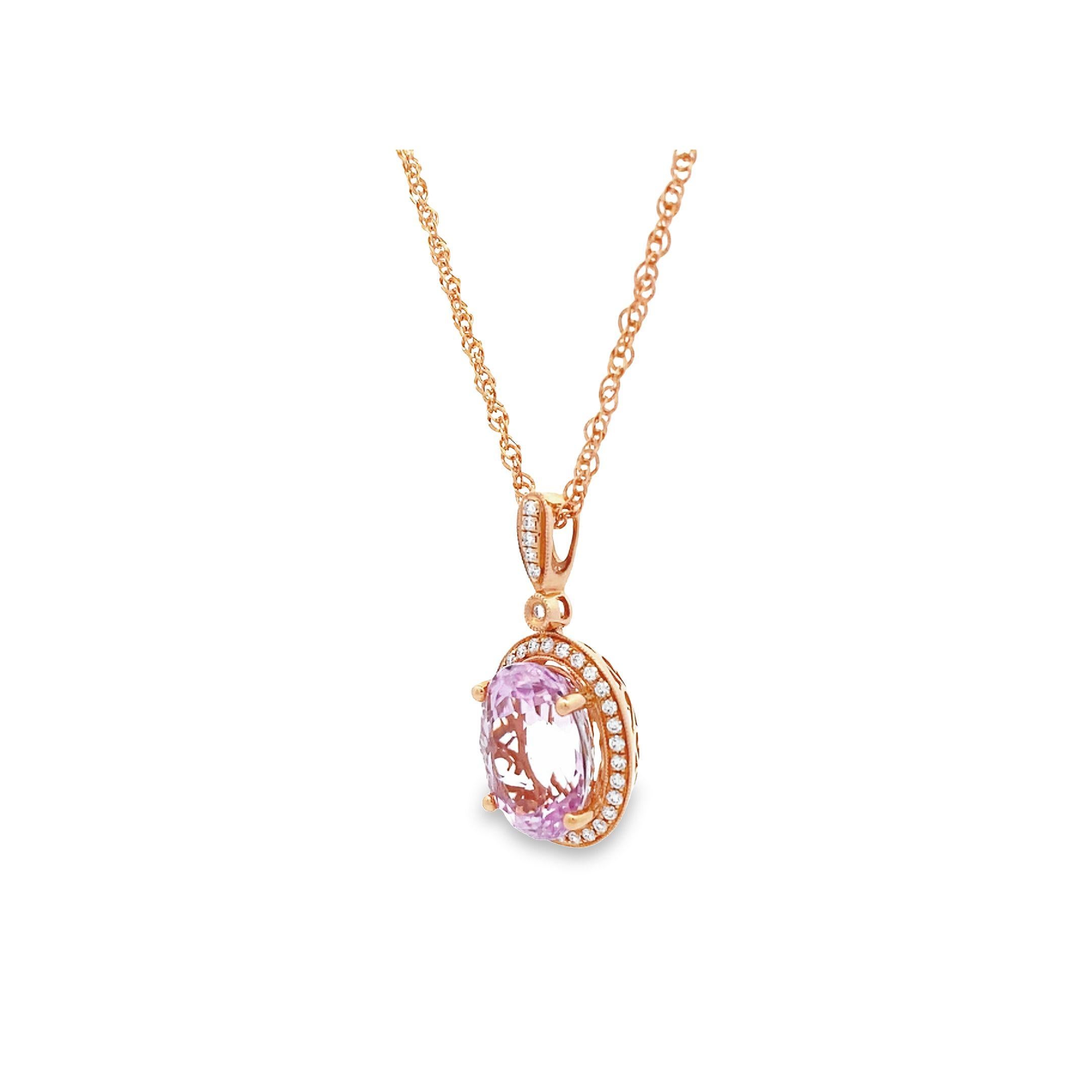 This modern and elegant necklace features a stunning 11.84 carat oval Kunzite gemstone prong-set in lustrous 14k rose gold. The soft pink hue of the Kunzite is beautifully complemented by the sparkle of the white melee diamond pave totaling 0.36