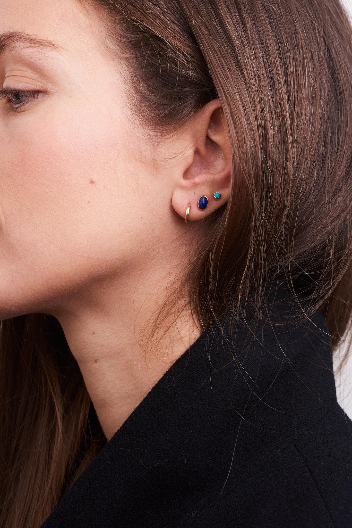 Handcrafted with the most beautiful deep blue genuine lapis stones, these earrings add a pop of deep blue to your wardrobe. They will quickly become a staple in your wardrobe. A simple, timeless statement. 
-14k solid gold
-6x4mm genuine oval lapis