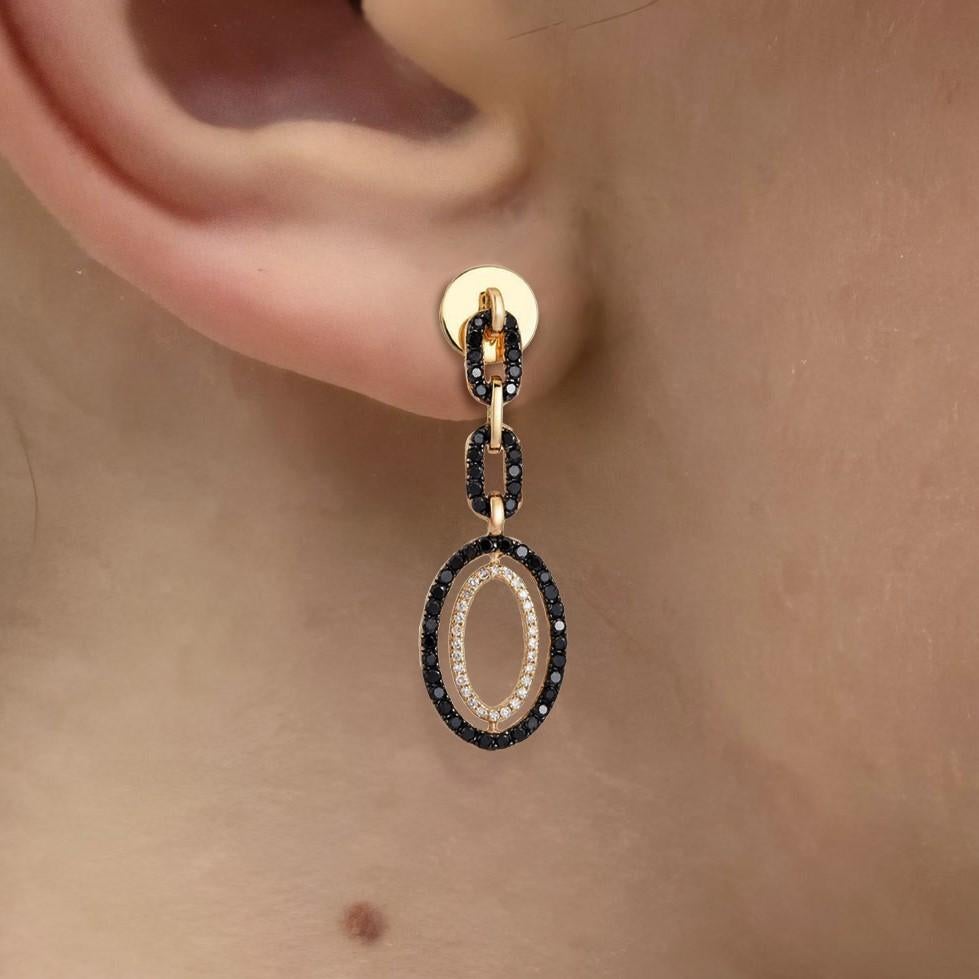 The Oval Link 14K Yellow Gold Diamond Drop Earrings, crafted in 14K yellow gold, feature a stunning combination of natural diamonds (D 0.12CT) and black diamonds (BD 0.72CT). These earrings offer a sophisticated drop design, with a bold contrast