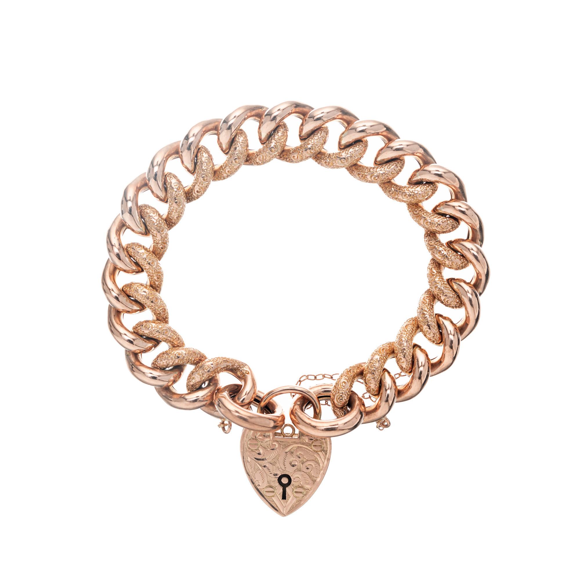 English puffed link hollow bracelet. Circa 1900's with hand engraving and a 9k rose gold heart lock catch. 7 inches long.

Tested: 9k rose gold
Width: 12.6mm
Depth or thickness: 6.4mm
Stamped: 9k
Weight: 29.6 grams


