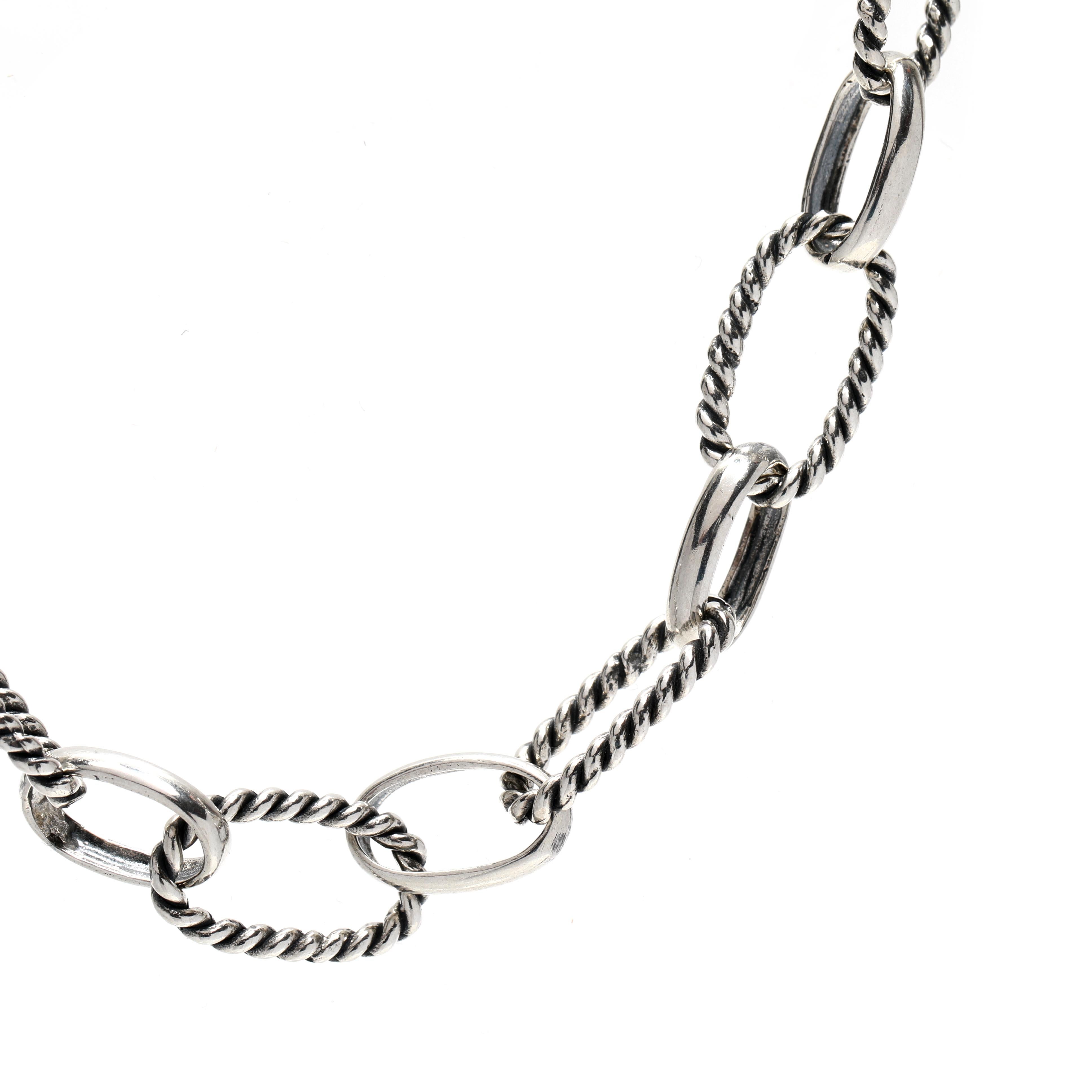 This beautiful Oval Link Toggle Chain is crafted from sterling silver and is 18 inches in length. With a large cable link chain and rope and polish links, this chain is perfect for any occasion or everyday wear. Whether you're looking for a chain to
