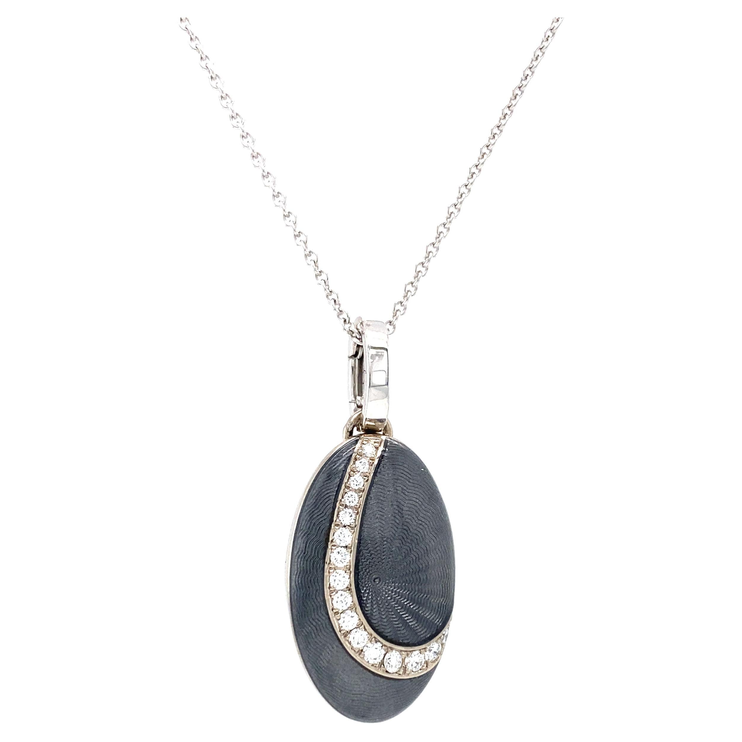 Victor Mayer oval locket pendant necklace 18k white gold, Peacock collection, light grey guilloche enamel, 16 diamonds, total 0.28 ct, G VS, brilliant cut, measurements app. 15.0 mm x 25.0 mm

About the creator Victor Mayer
Victor Mayer is