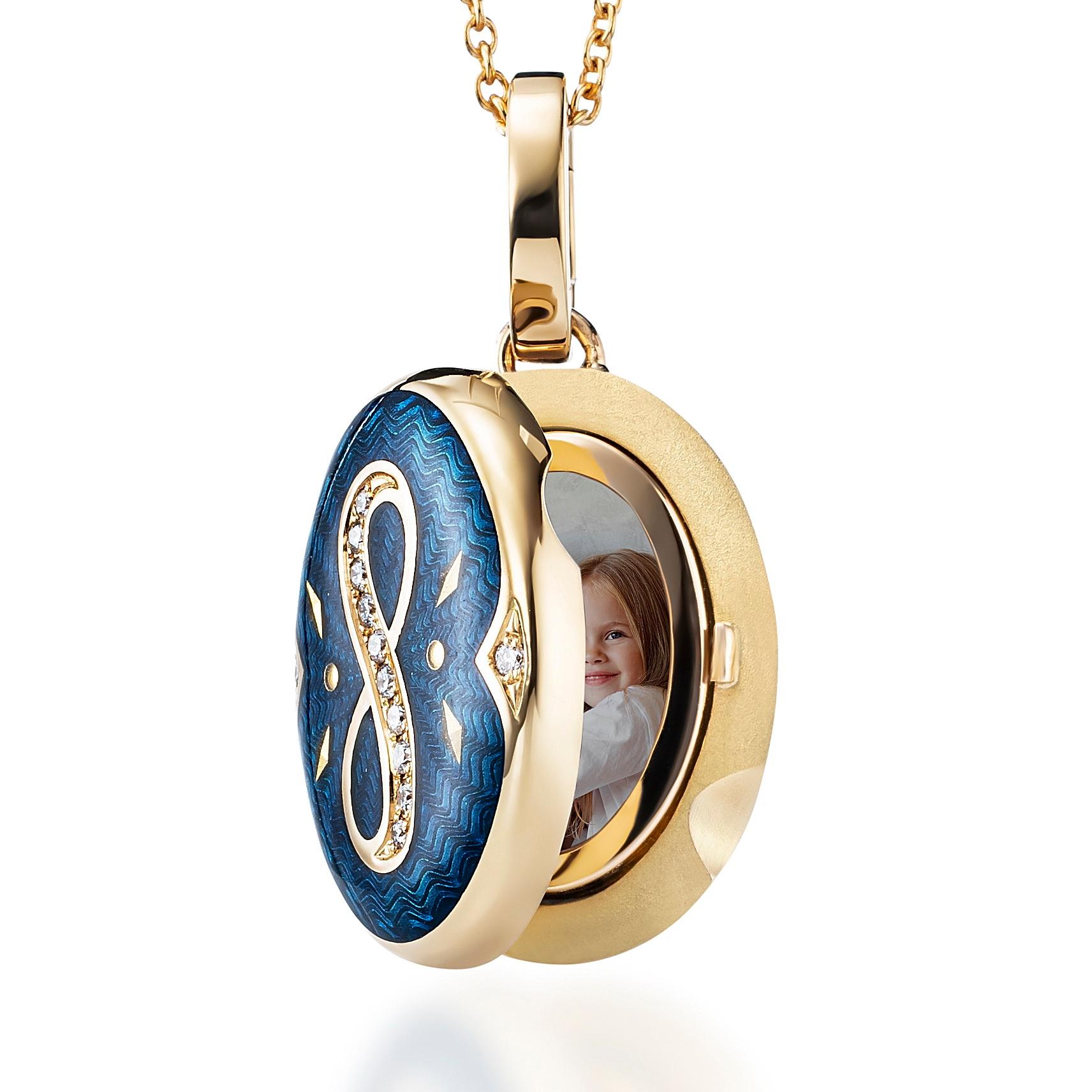 Victor Mayer oval locket pendant necklace with infinity symbol 18k yellow gold, Victoria Collection, translucent peacock blue vitreous enamel, gold paillons, 12 diamonds, total 0.08 ct, G VS, brilliant cut, measurements app. 15.0 mm x 20.0 mm

About