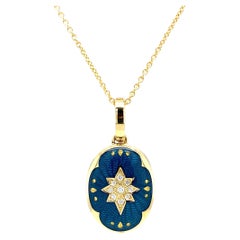 Collier pendentif médaillon ovale en or jaune 18 carats, émail bleu et 9 diamants 0,07 carat G VS