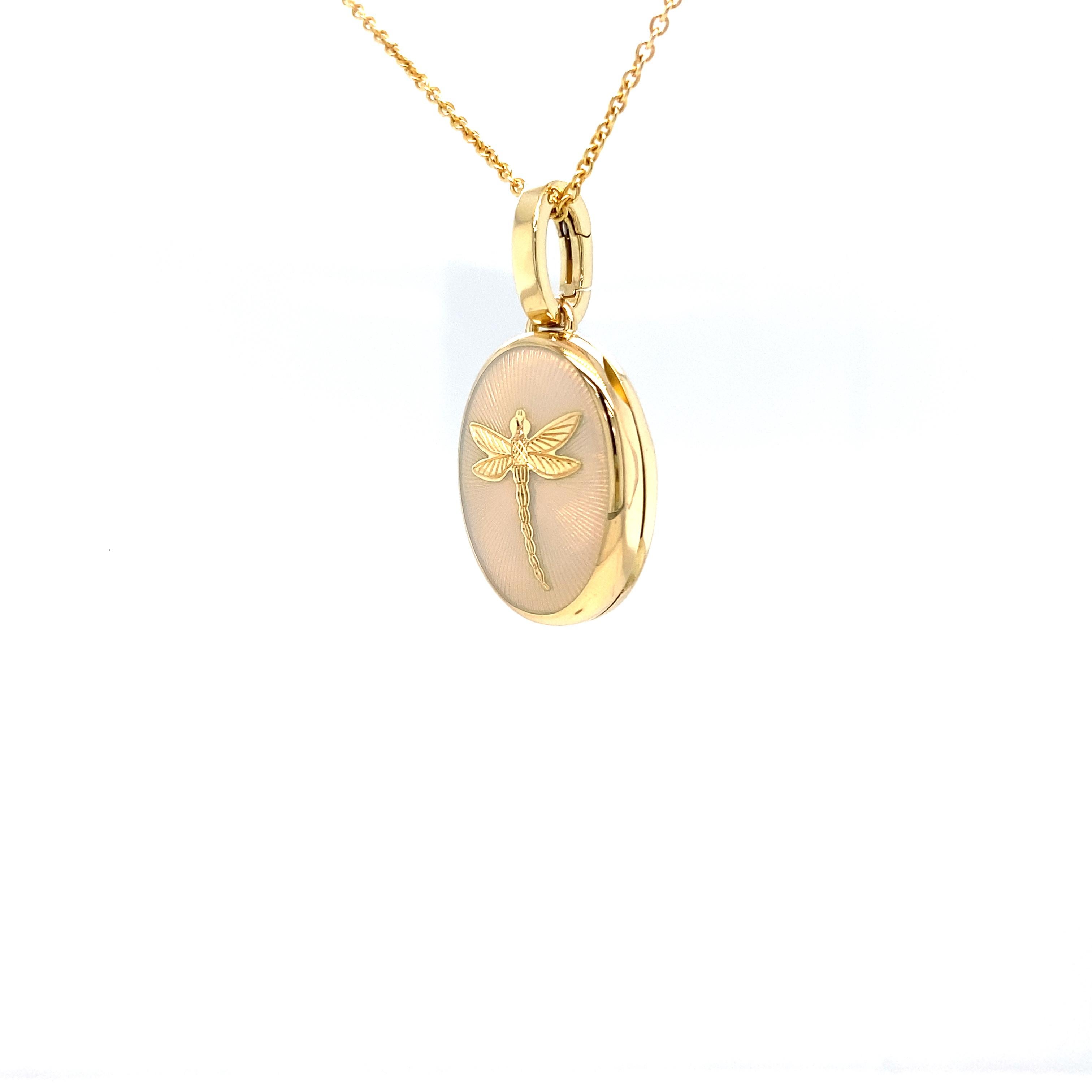 Victor Mayer customizable oval locket pendant necklace with dragonfly 18k yellow gold, Hallmark collection, translucent opalescent white vitreous enamel, guilloche, measurements app. 15.0 mm x 20.0 mm

About the creator Victor Mayer
Victor Mayer is