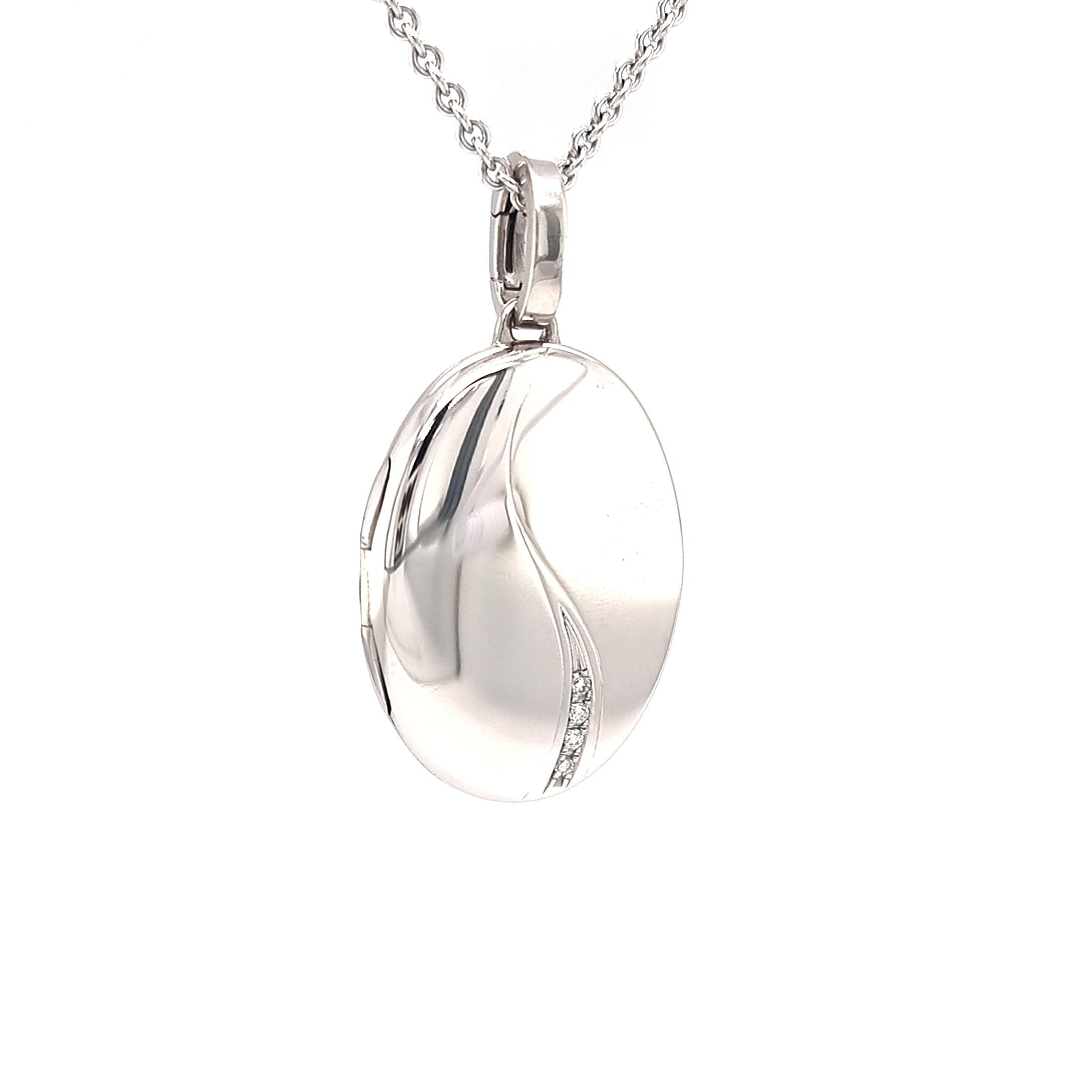 Oval locket pendant necklace, Hallmark Collection by VICTOR MAYER, 18k white gold, solid version, 4 diamonds, total 0.04 ct, H VS with two picture frames, made in Germany

About the creator Victor Mayer
Victor Mayer is internationally renowned for
