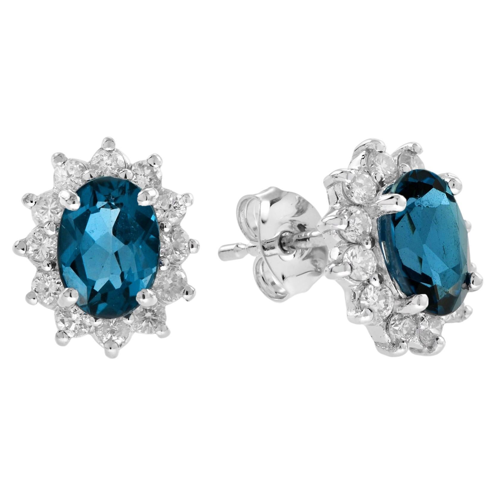 Oval London Blue Topaz and Diamond Halo Stud Earrings in 18K White gold For Sale