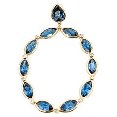Ciondolo ovale con topazio blu di Londra e diamanti in oro giallo 14k