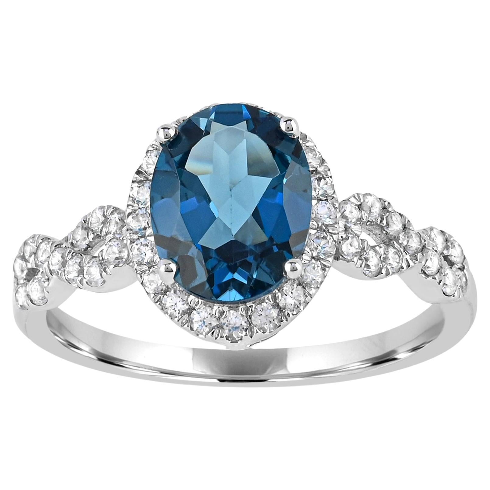 Oval London Blue Topaz with White Zircon Halo infinity ring in 10K White Gold For Sale