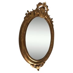 Oval Louis XVI mirror with gold leaf