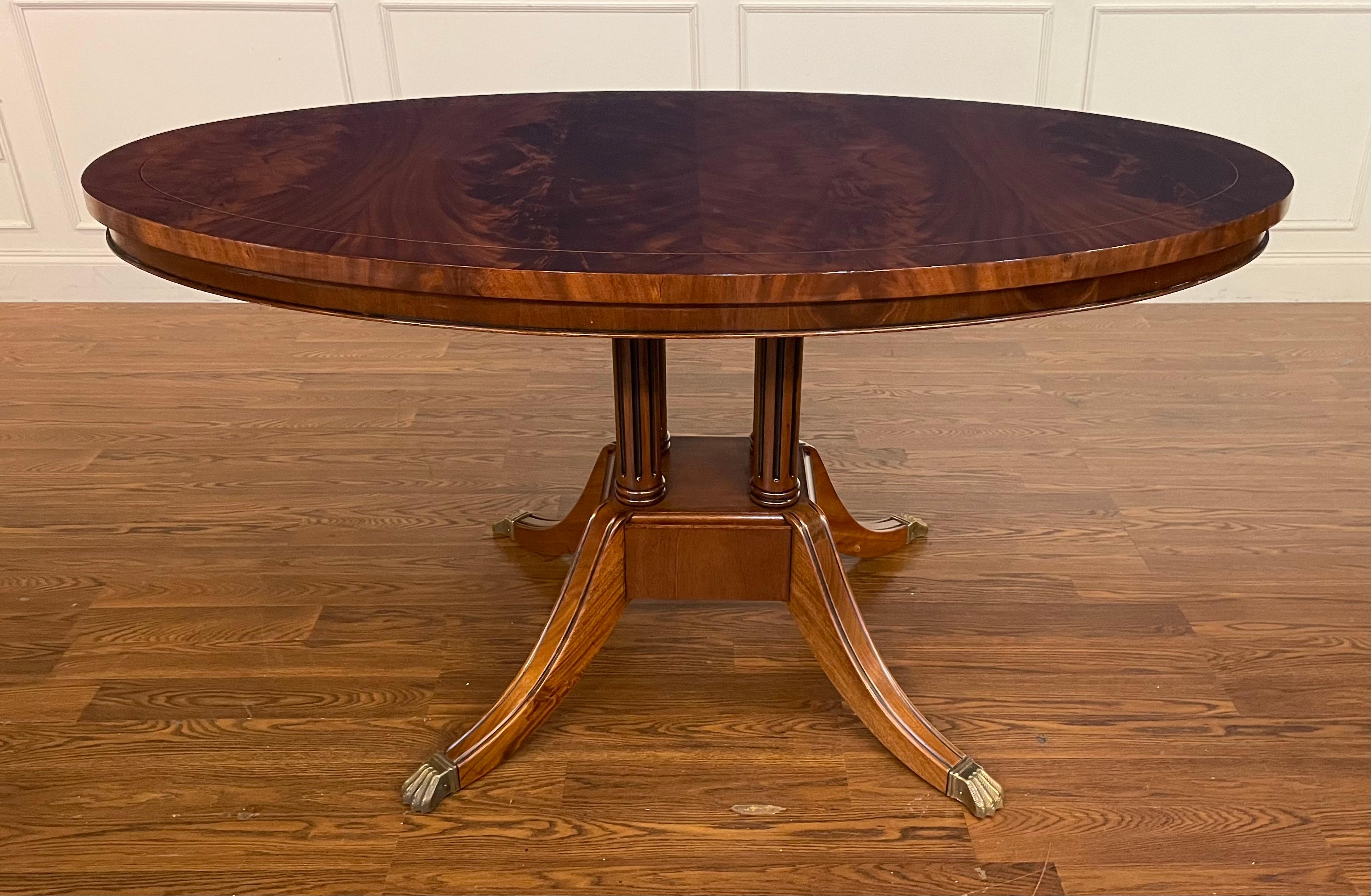 This is an oval mahogany table made-to-order in the Leighton Hall shop in Suwanee, Georgia. This table is ideal as a breakfast table, dining table for an apartment, game table, or foyer table. It features a field of booked and butted swirly crotch