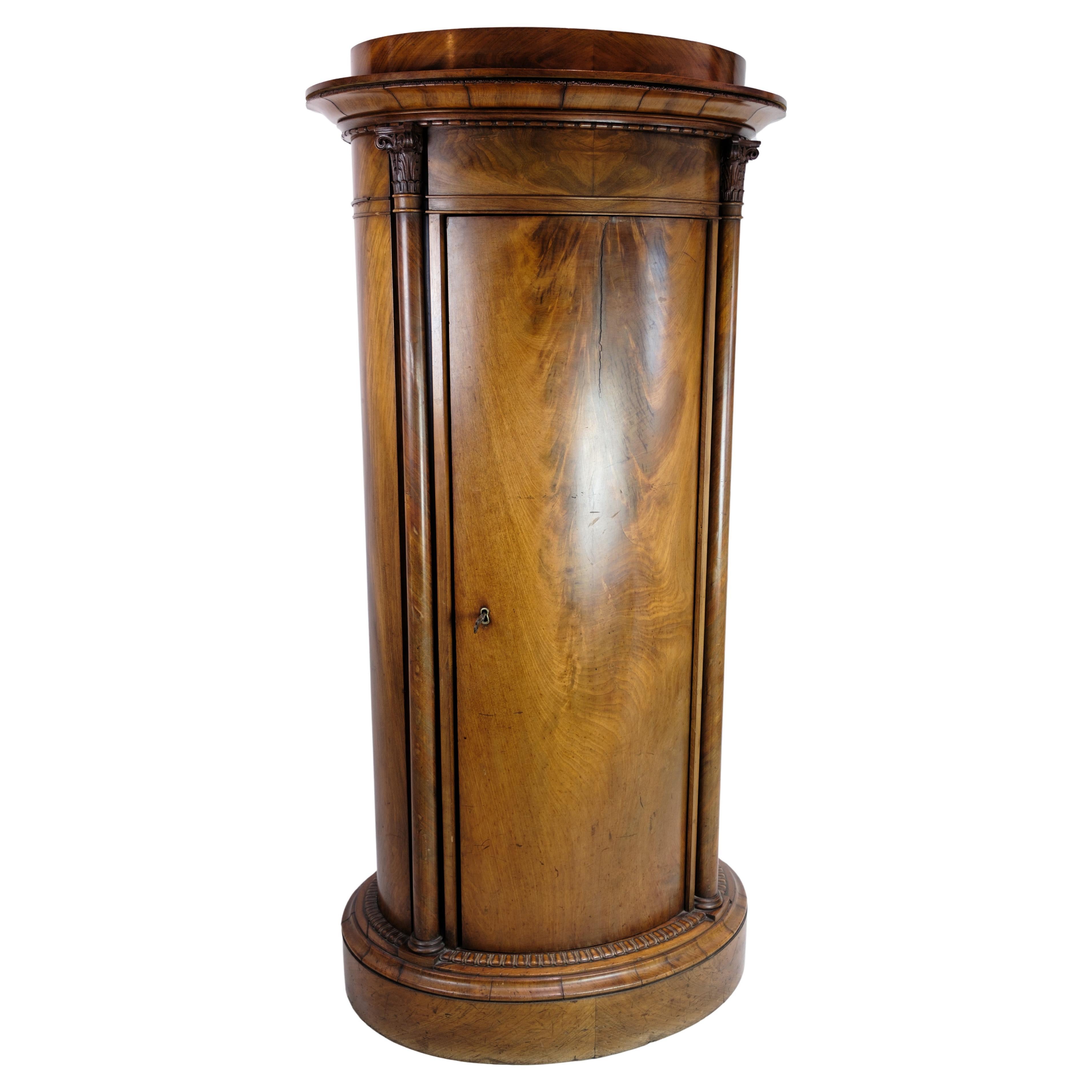 Oval Mahogany Pedestal Cabinet With Carvings From The 1820's  For Sale