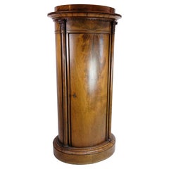 Oval Mahogany Pedestal Cabinet With Carvings From The 1820's 