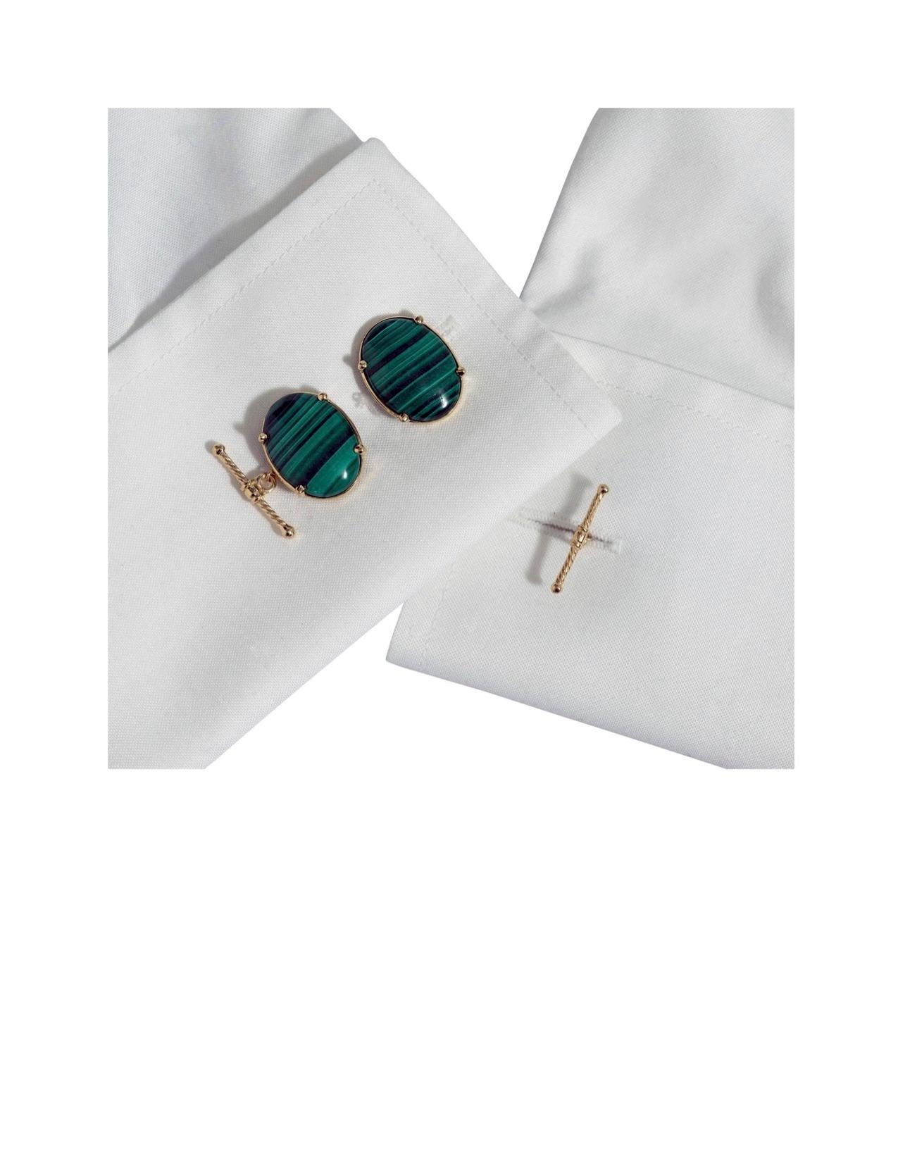 These striking cufflinks, designed to be worn with a French cuff shirt by either a man or a woman, are shown set in 14K yellow gold and feature a chain and solid gold T-bar.  The T-bar is a signature Dudley VanDyke design.  The Malachite is 15 x 20