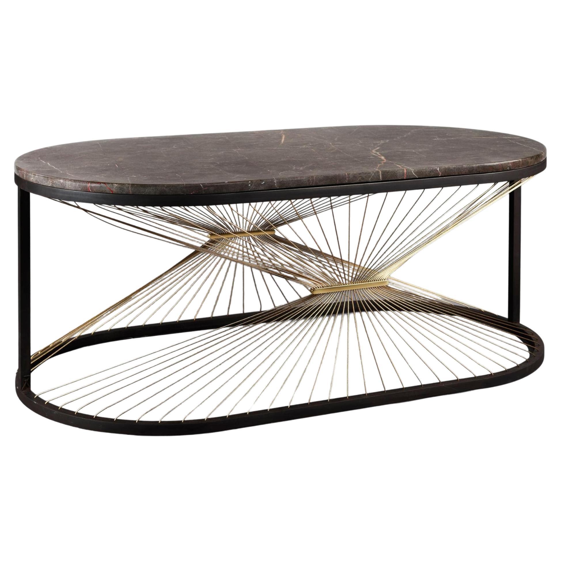 Centered at the heart of the entertaining space this coffee table strikes the perfect balance between practicality and aesthetic elegance. With a show stopping oval form the table feels like a work of art and is sure to draw attention with its