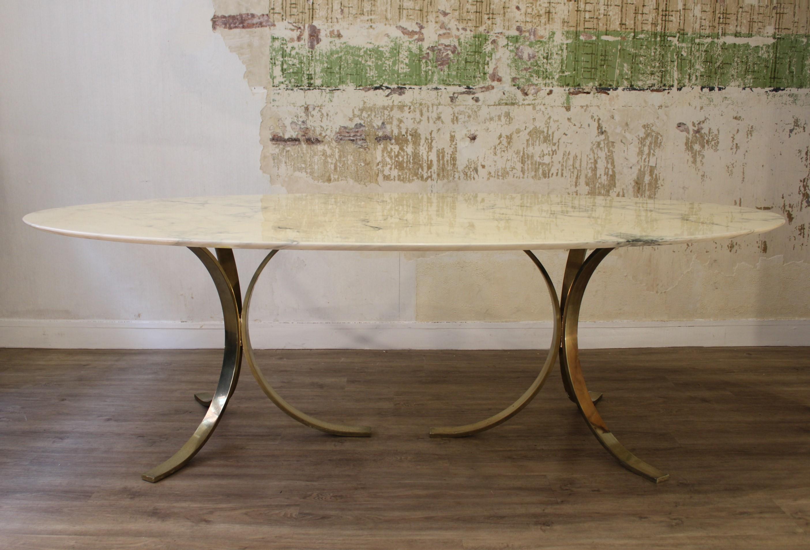 Oval dinning table by Osvaldo Borsani 
Calacatta marble, golden steel base
Italy 20th century