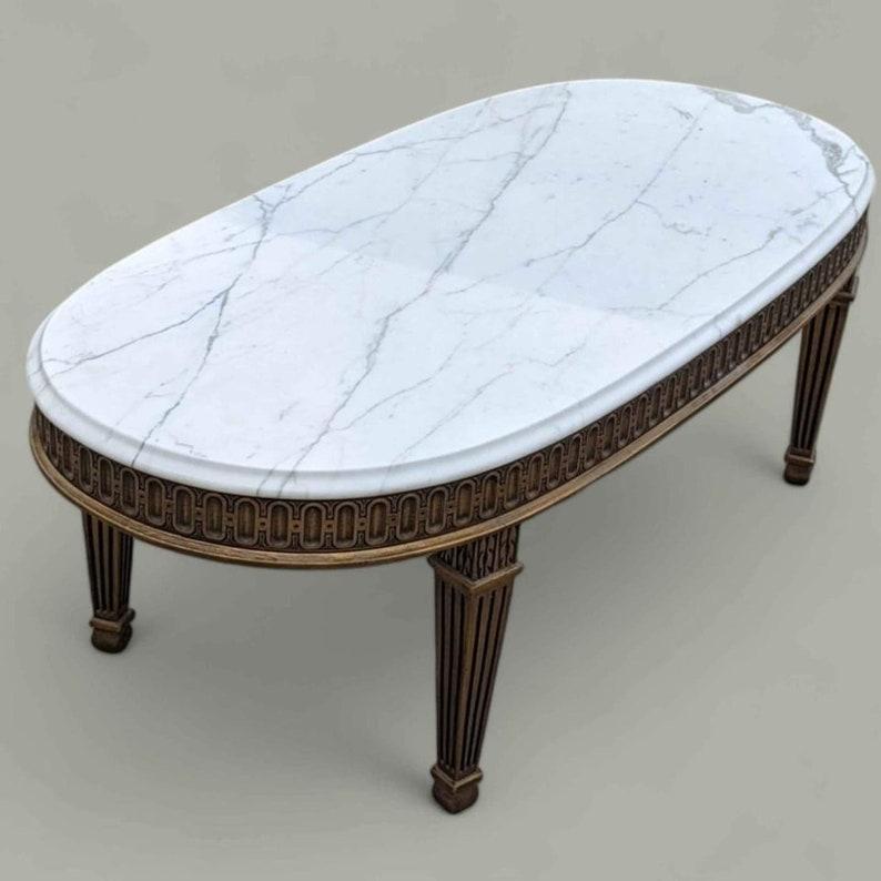 Antique Marble Top Coffee Table, Vintage Living Room, Hollywood Regency, Art Deco, Ornate, Carved Wood

Measurements: 53.5