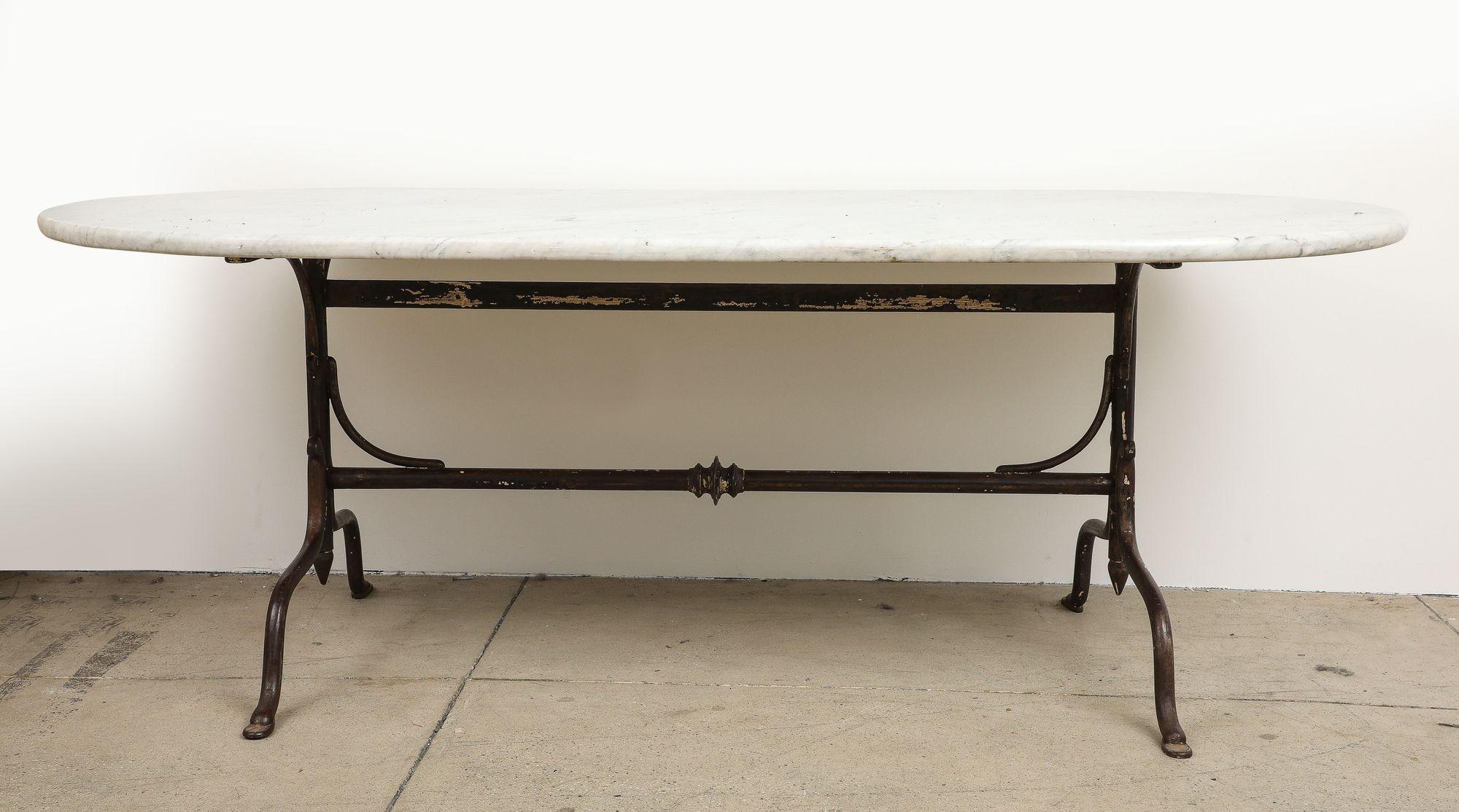 Oval Marble Topped Dining Table with Trestle Iron Base, France mid 20th c In Good Condition For Sale In South Salem, NY