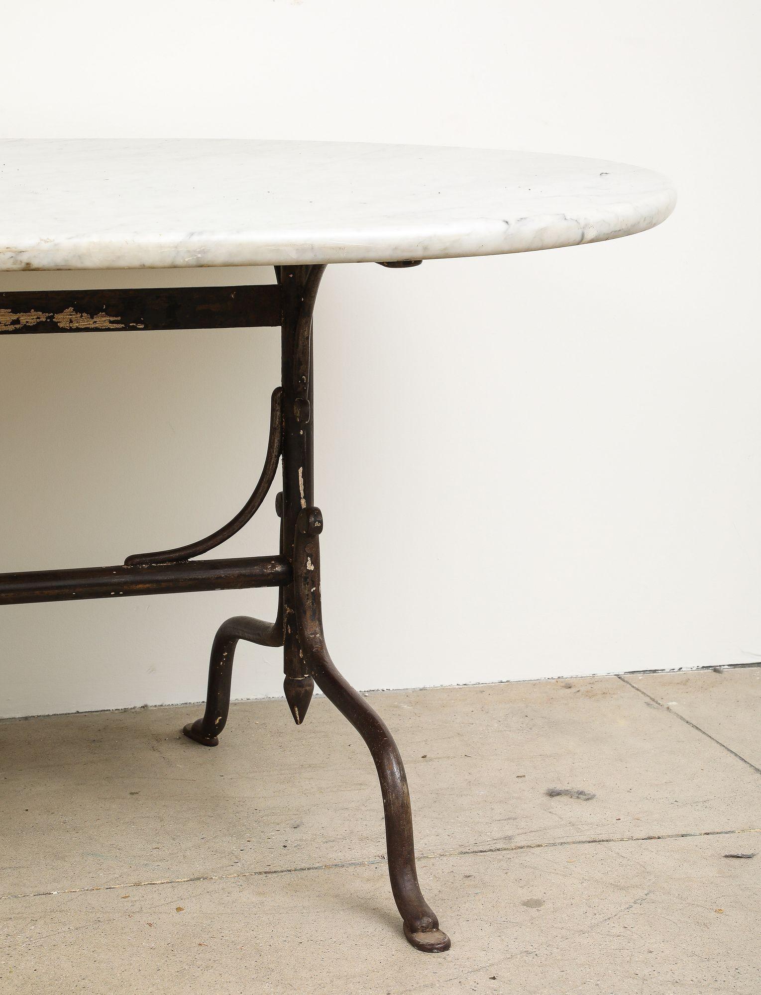 20th Century Oval Marble Topped Dining Table with Trestle Iron Base, France mid 20th c For Sale