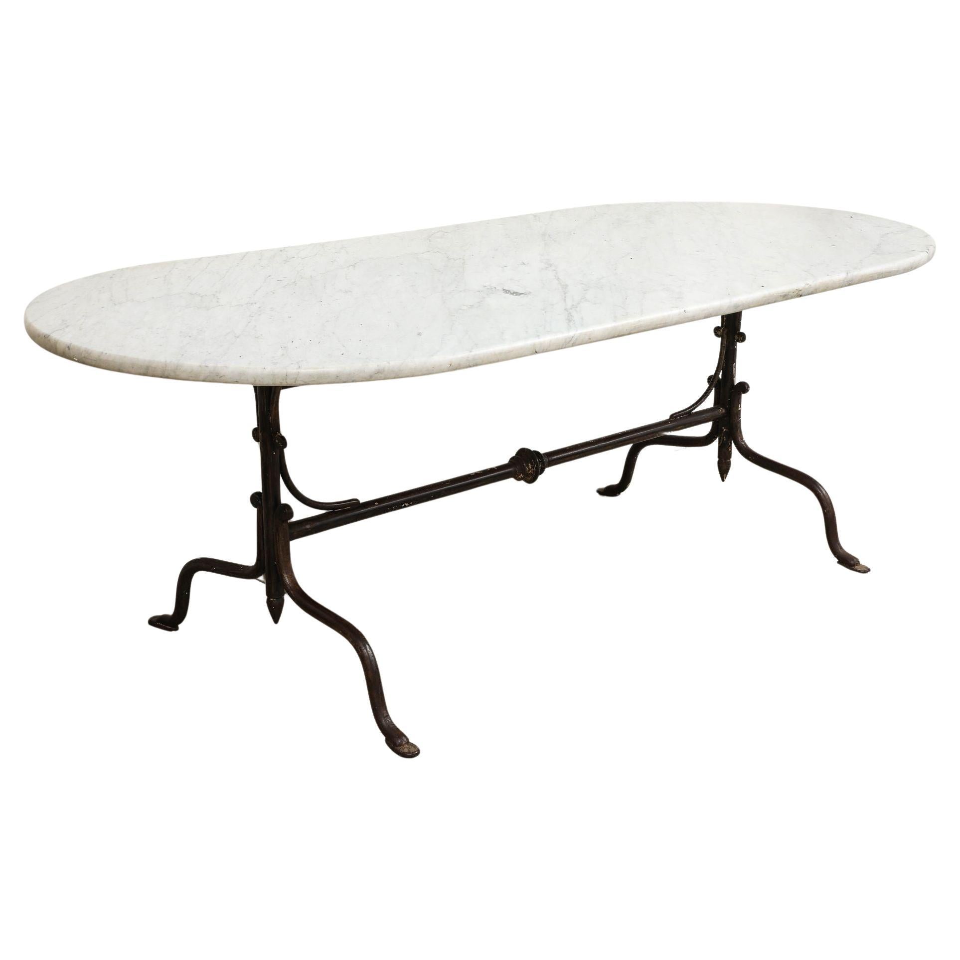 Oval Marble Topped Dining Table with Trestle Iron Base, France mid 20th c For Sale